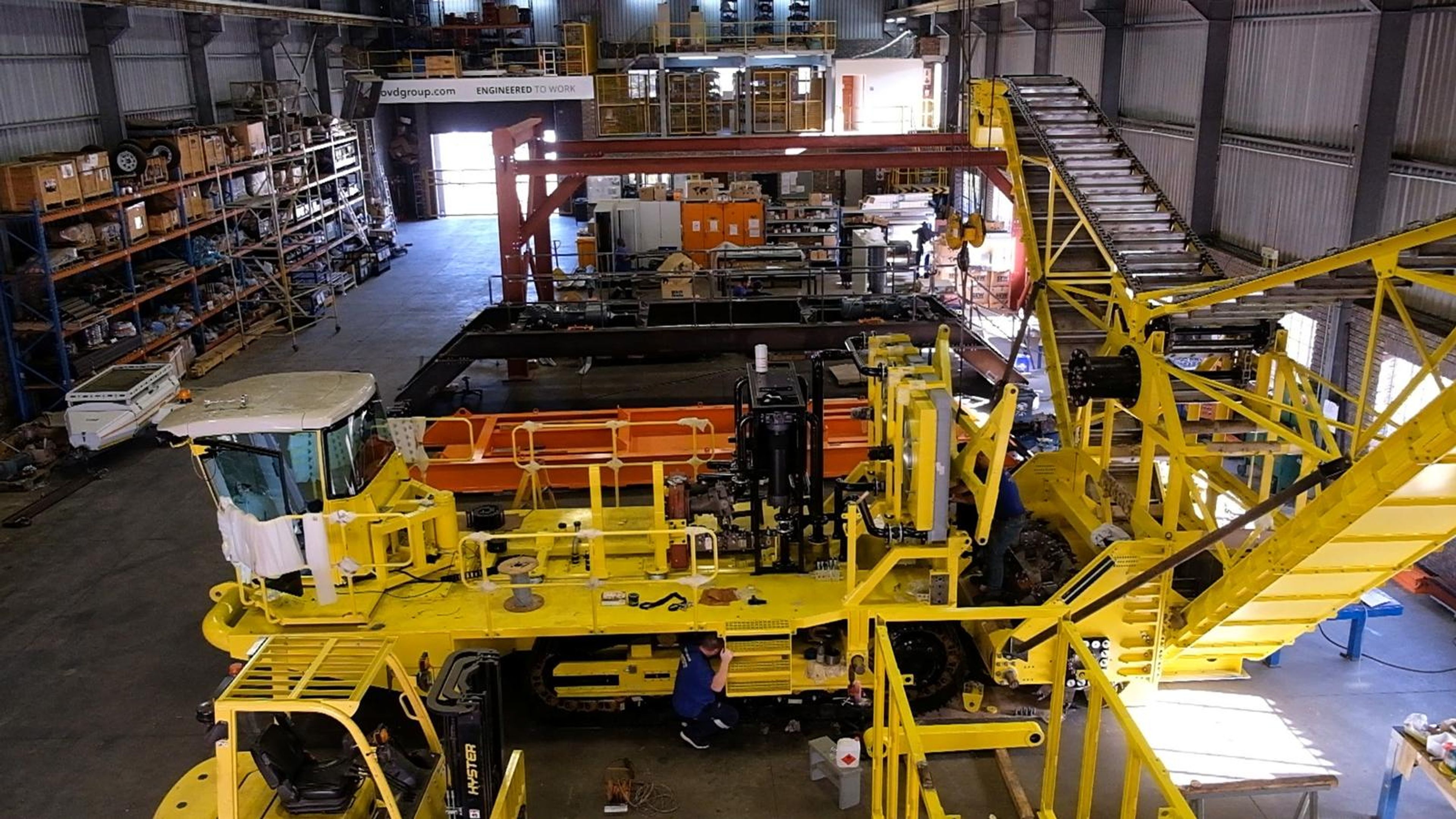 Wide high angle view of the yellow salt harvester under assembly in the plant