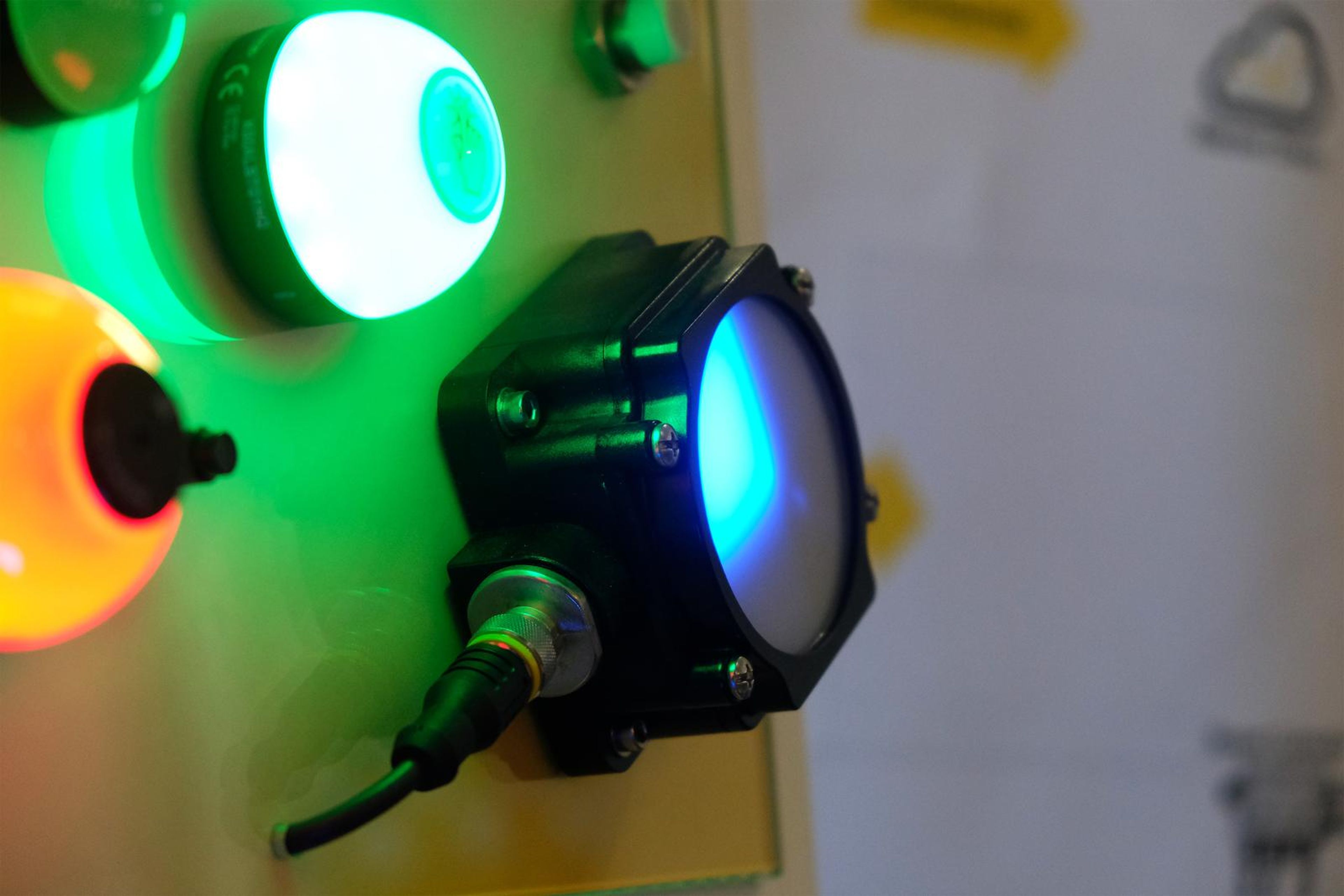 Green and blue indicator lights on a Turck panel