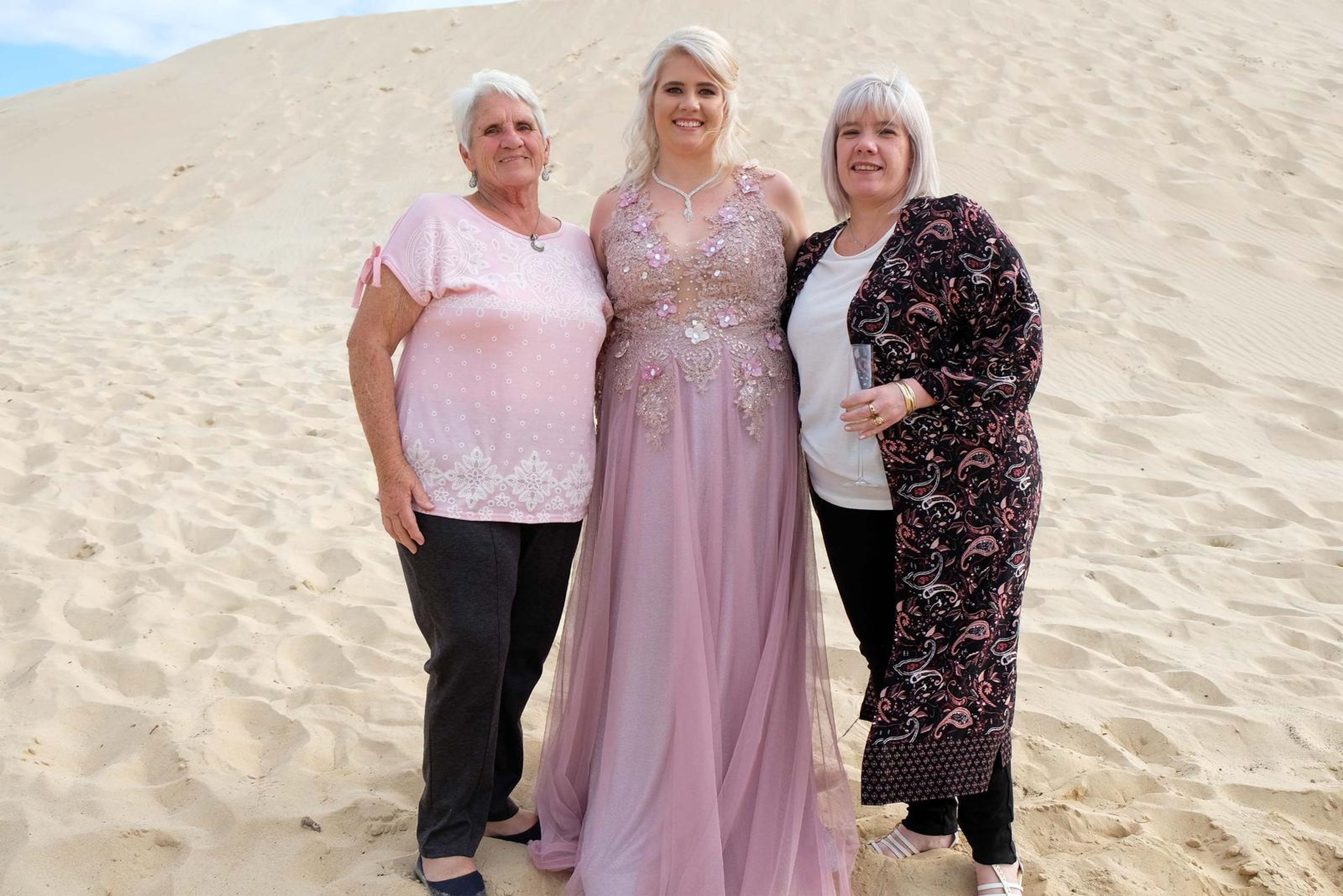 Family group portrait on the dunes