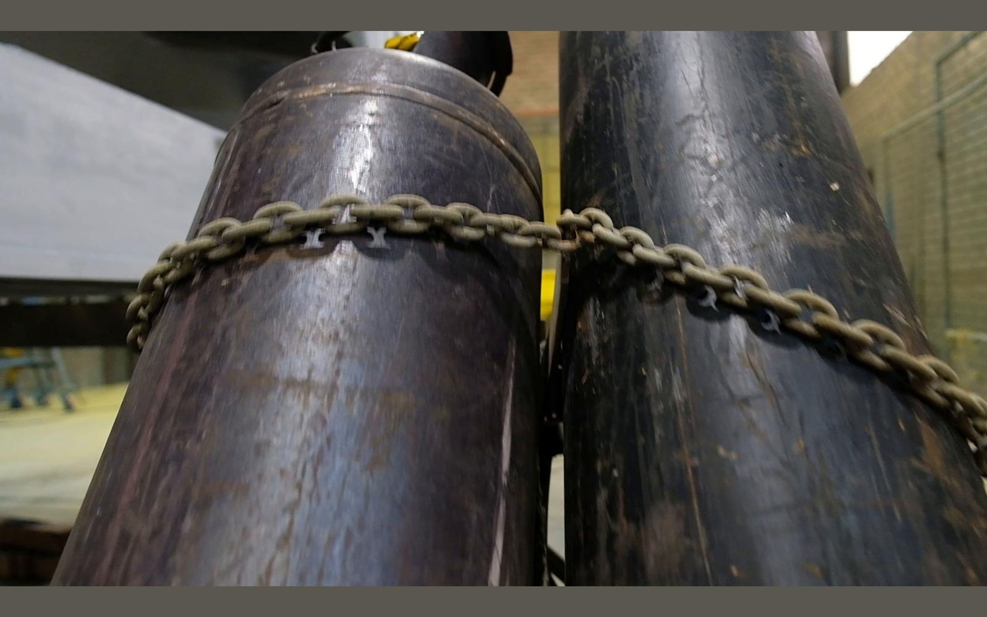 Large steel tubes chained together