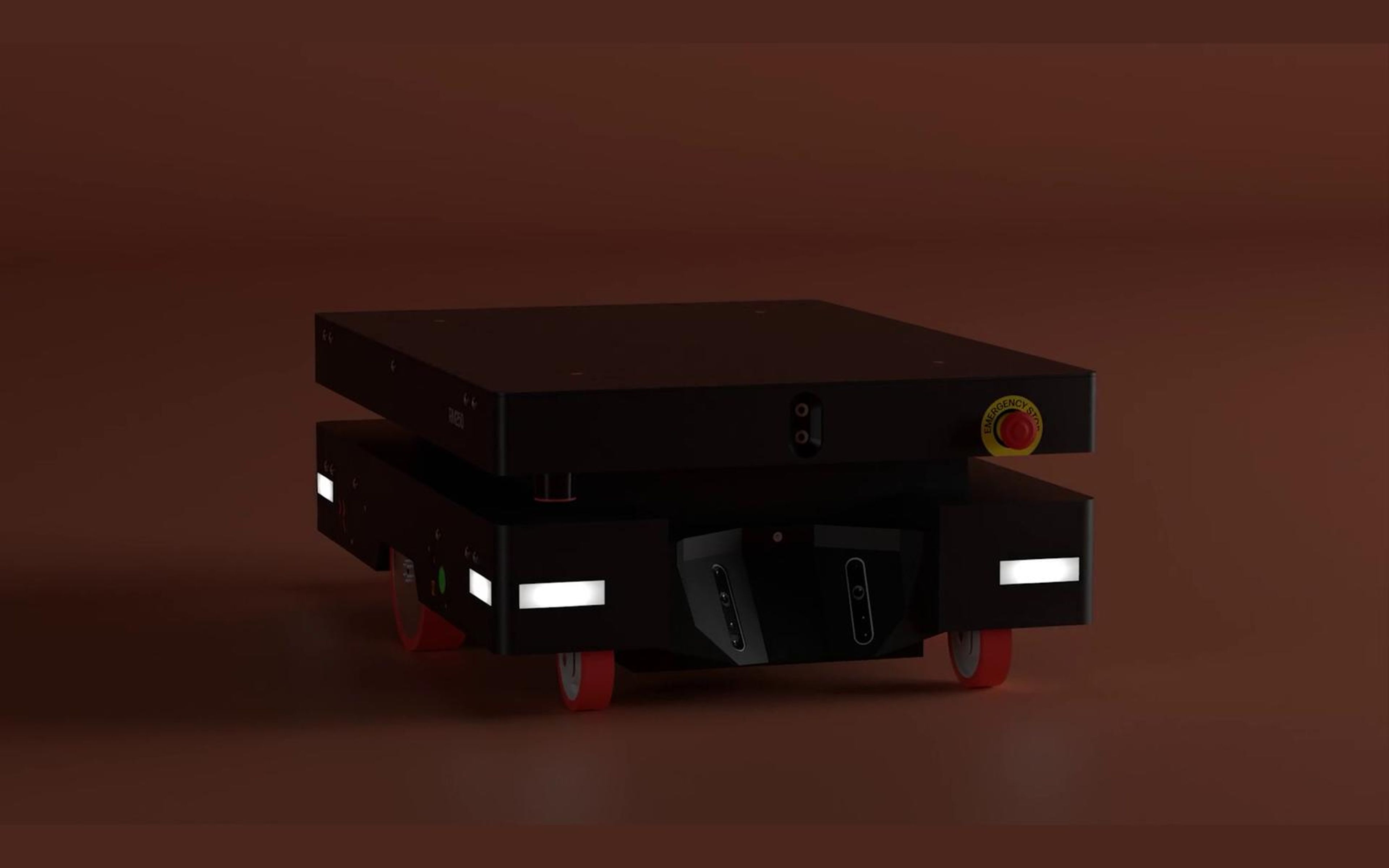 Autonomous mobile robot on a warm red background