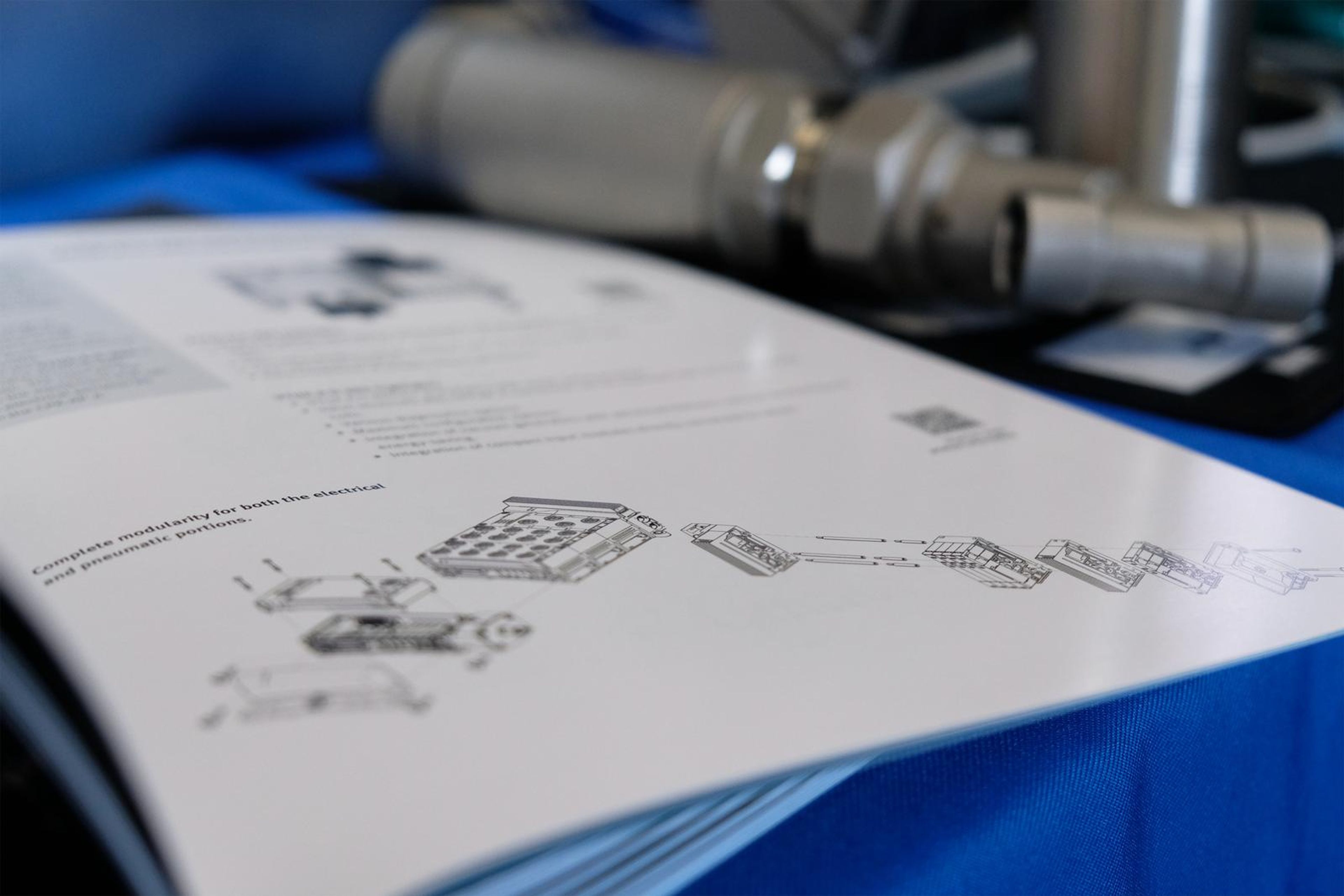Festo brochure beside pneumatic parts