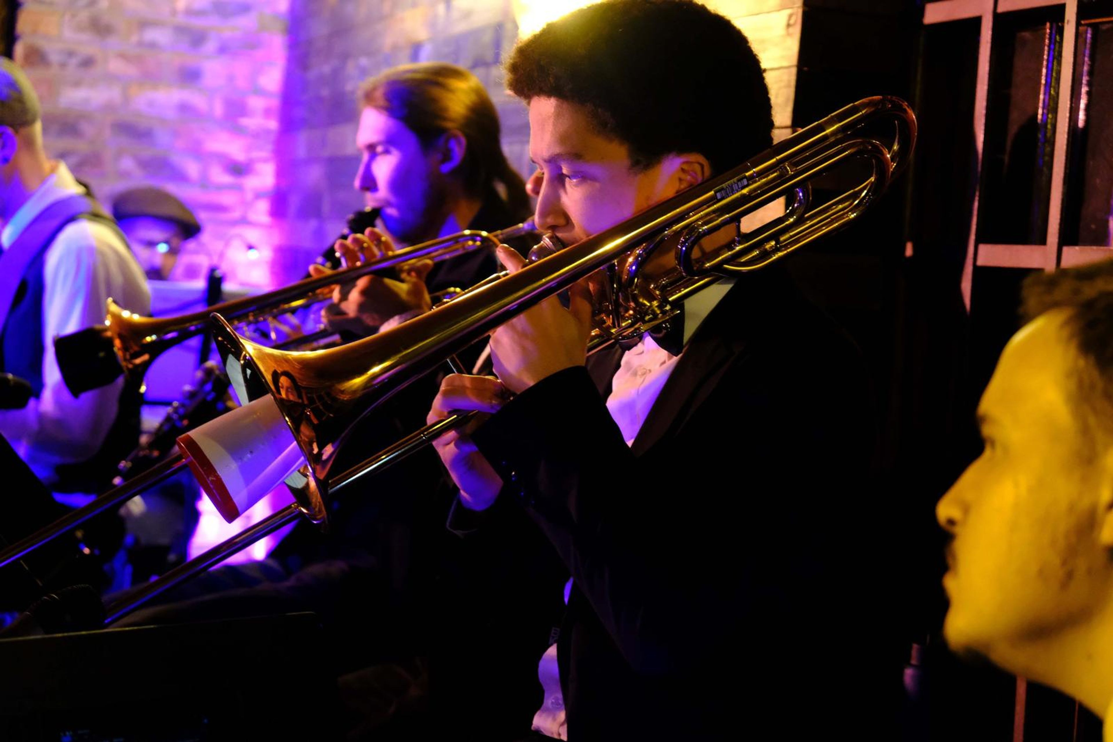 Trombone player and trumpeter playing side by side