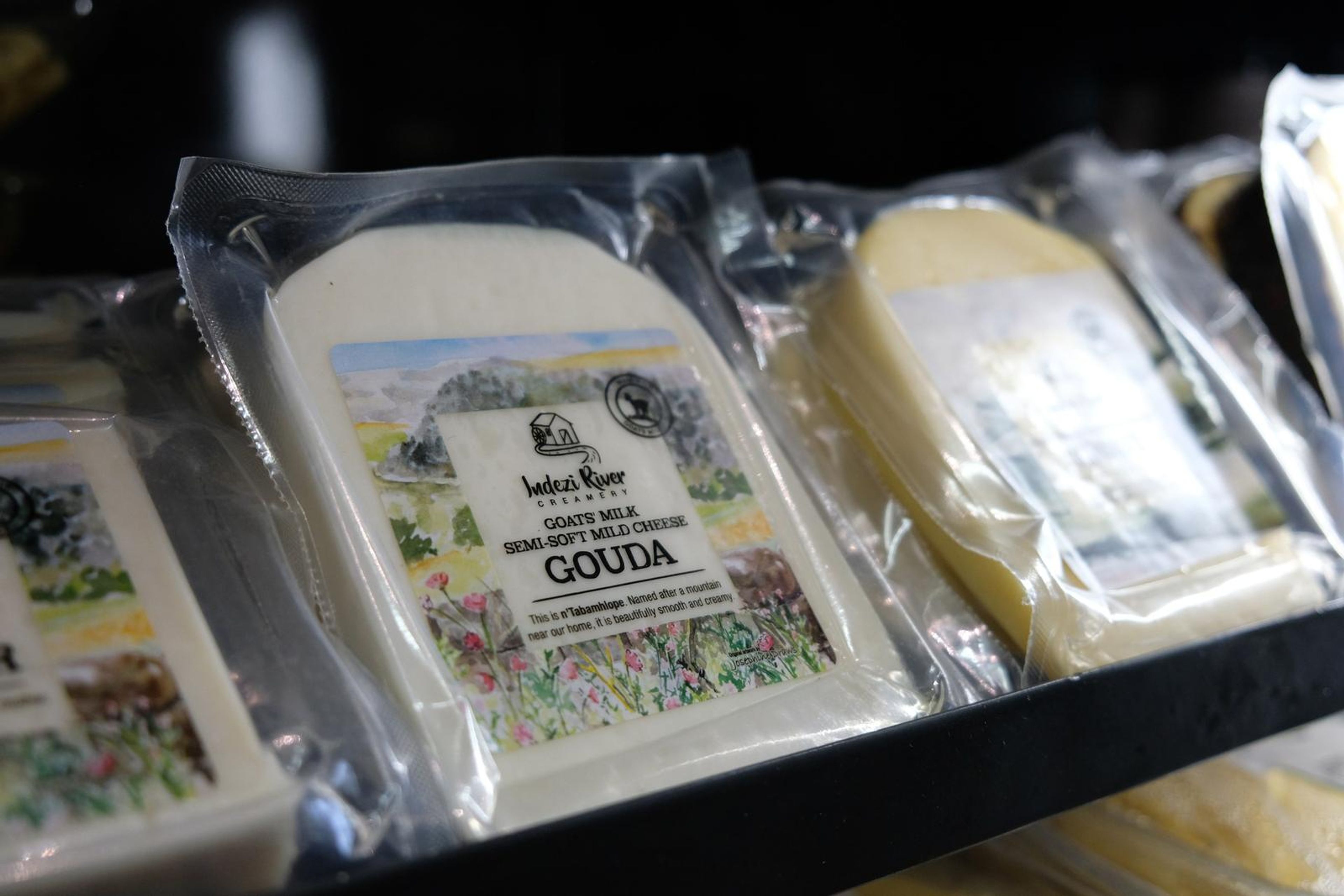 Packs of Gouda and other local cheeses in the fridge