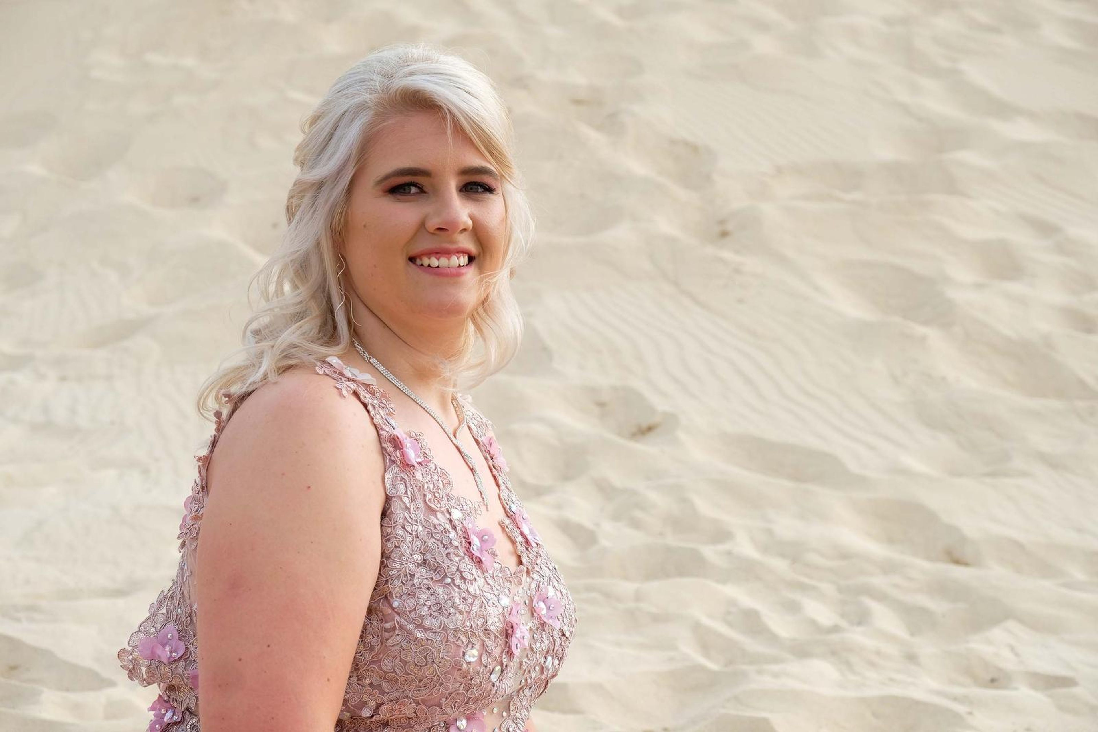 Smiling portrait with soft light on the dune