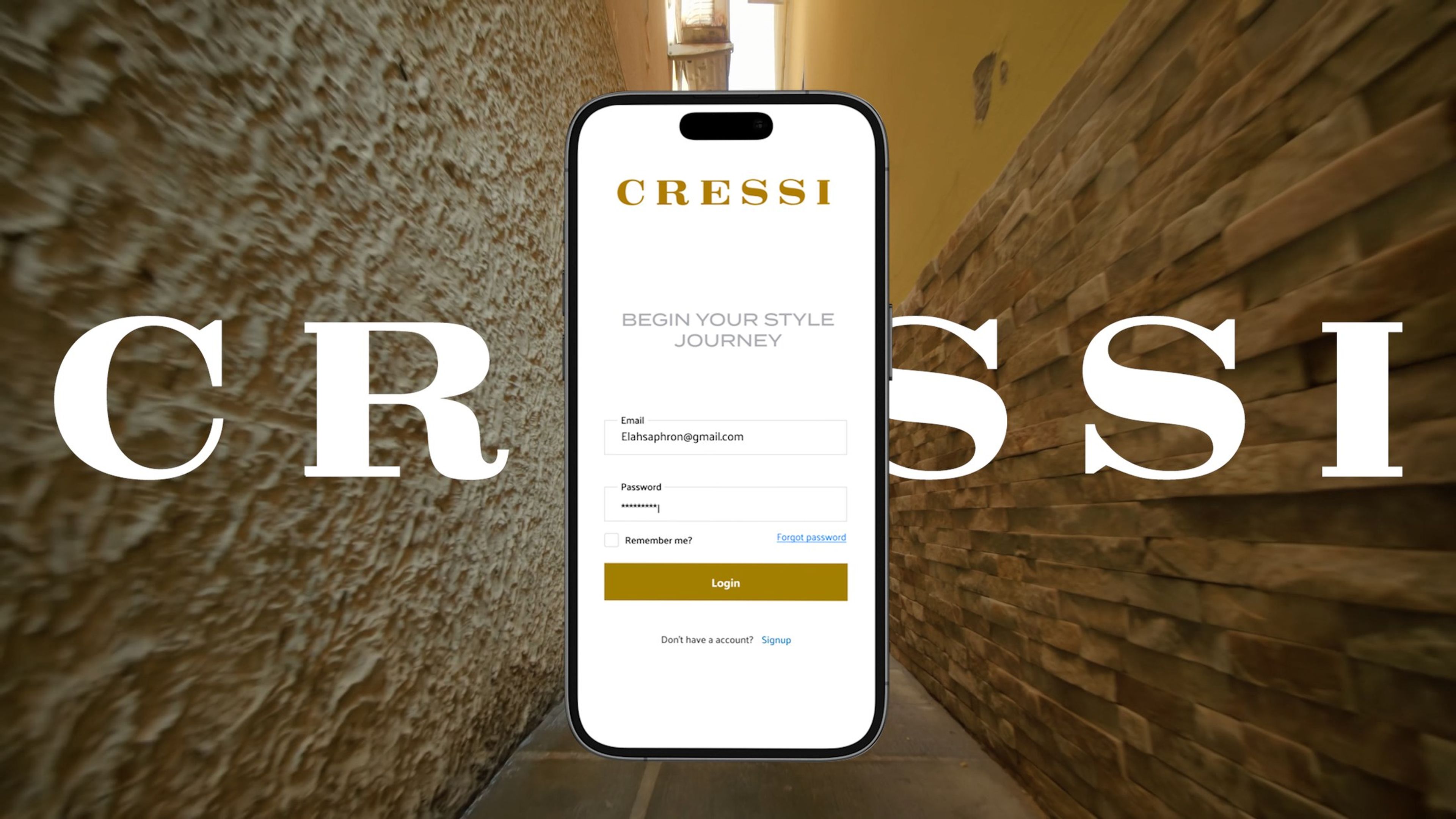 Phone showing the CRESSI login screen against a textured amber wall
