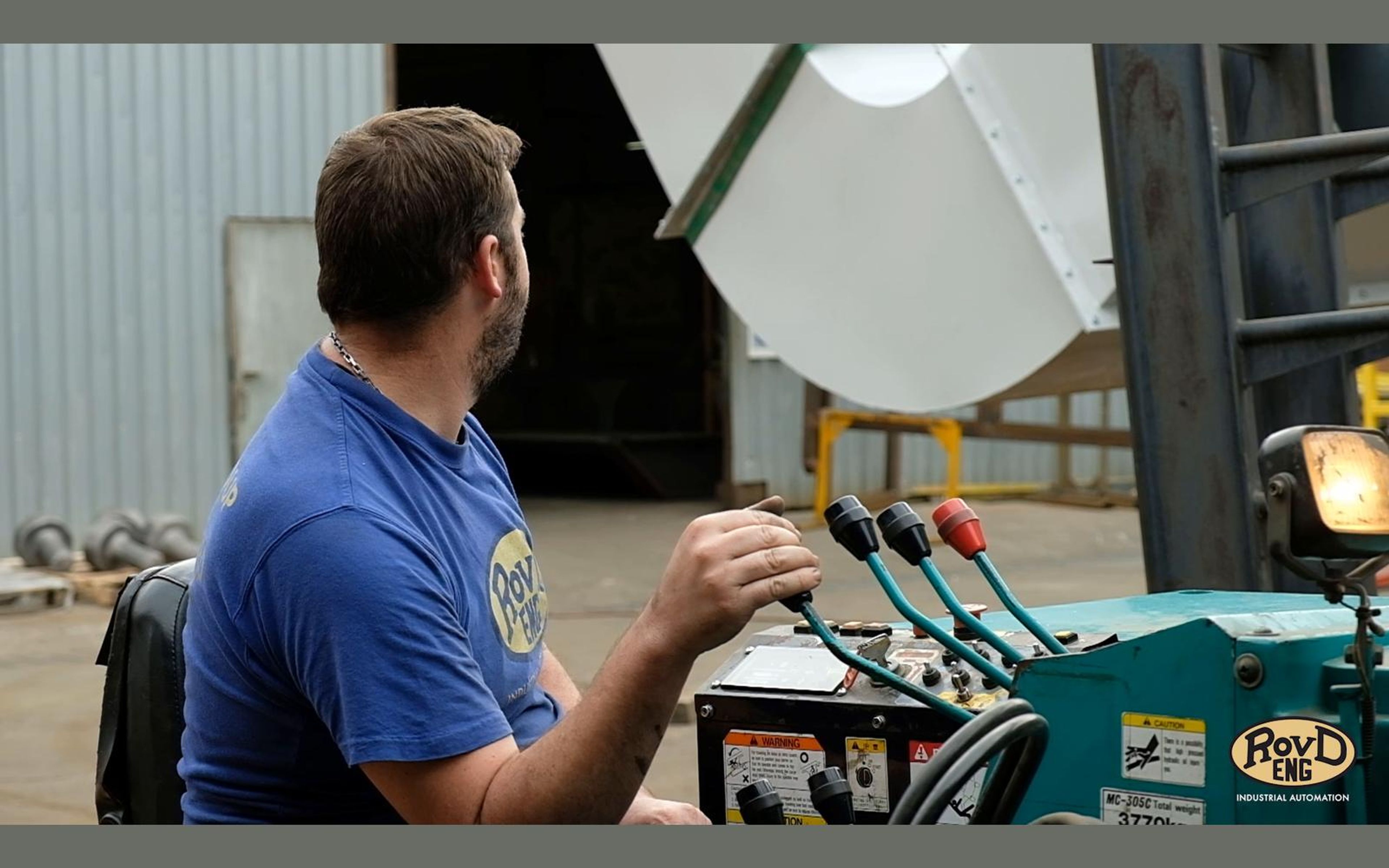 Worker operating a machine control