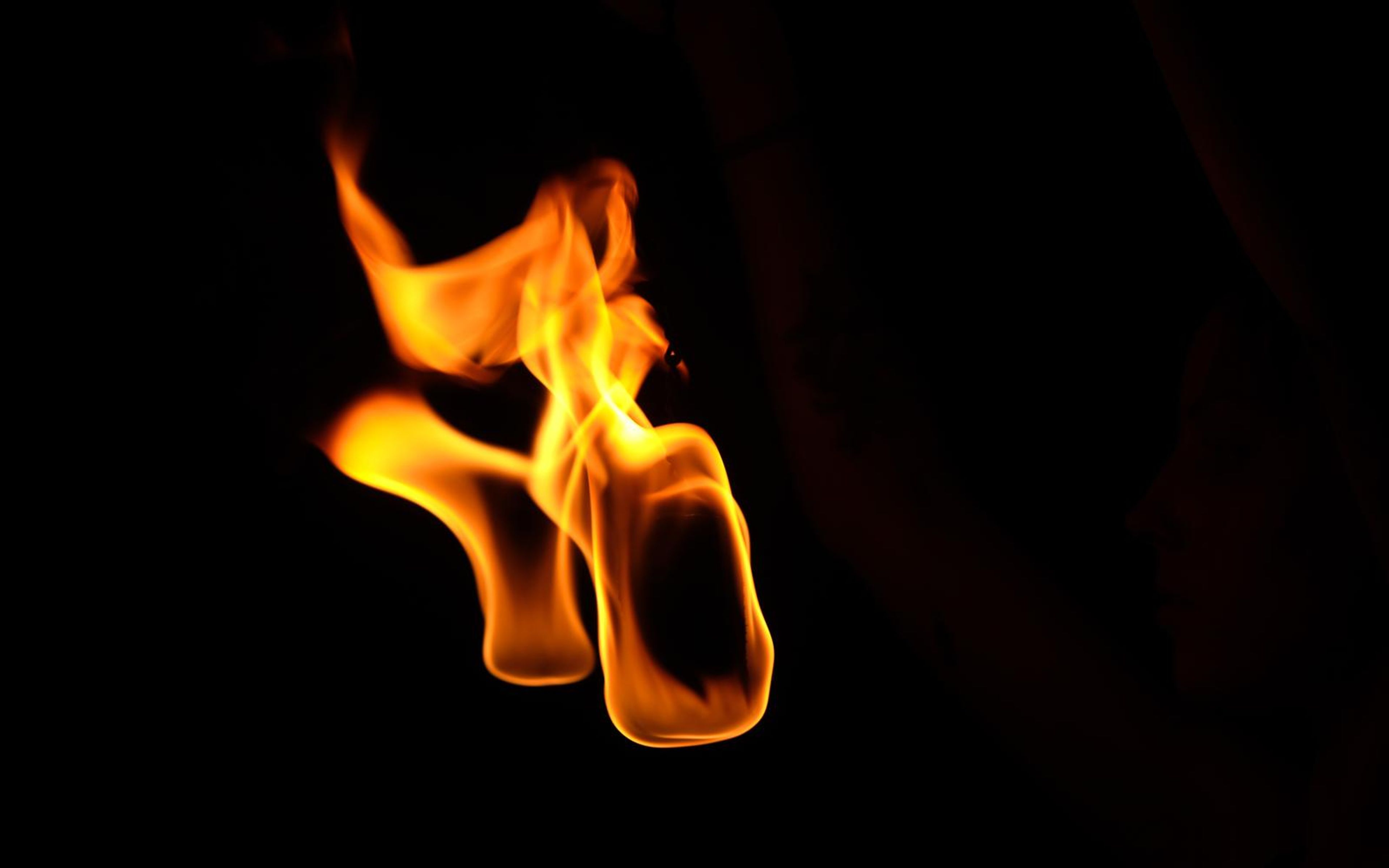 Two flames leaning together with an upper flick at the left