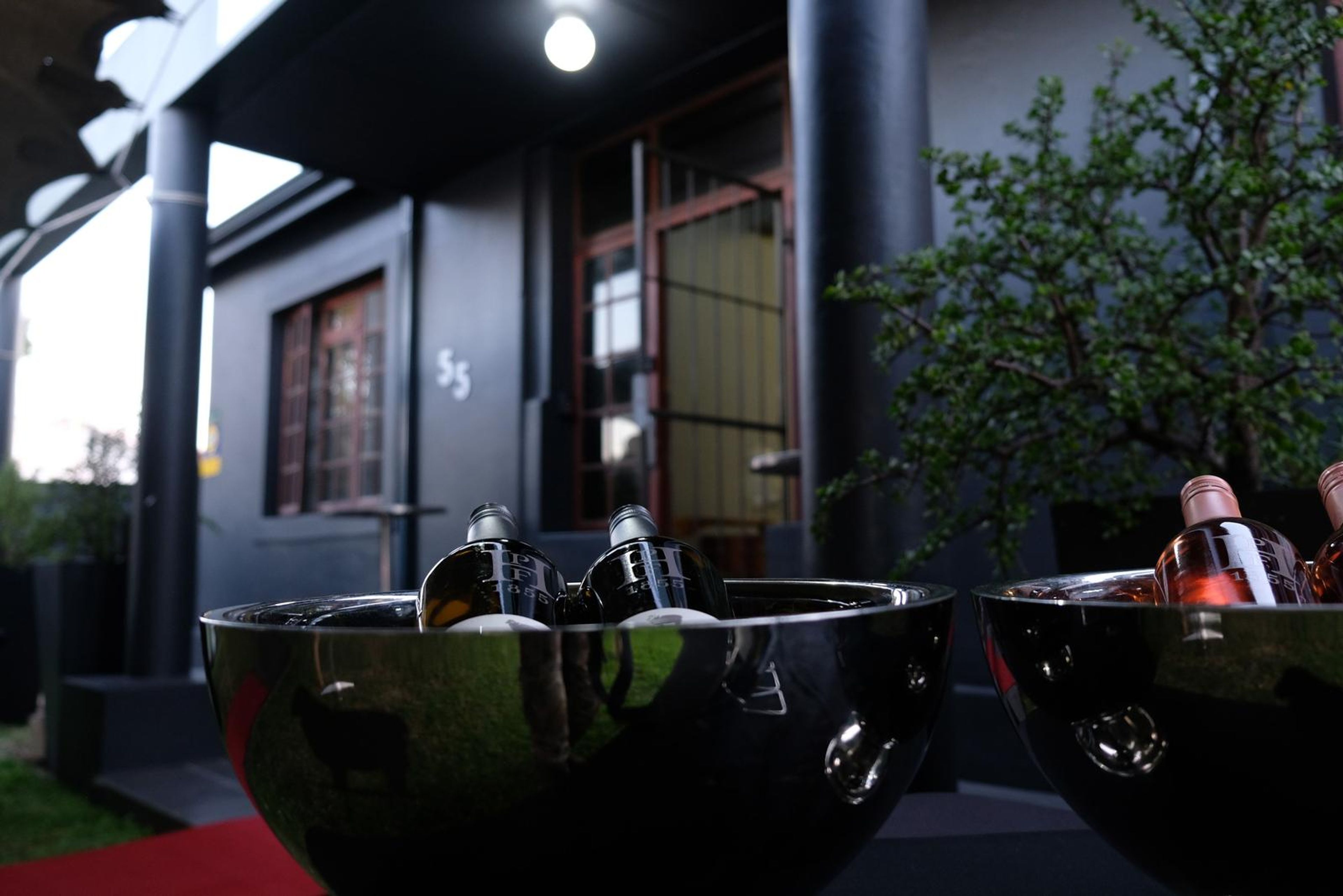 Silver ice buckets of wine on the terrace outside The Chef's Larder