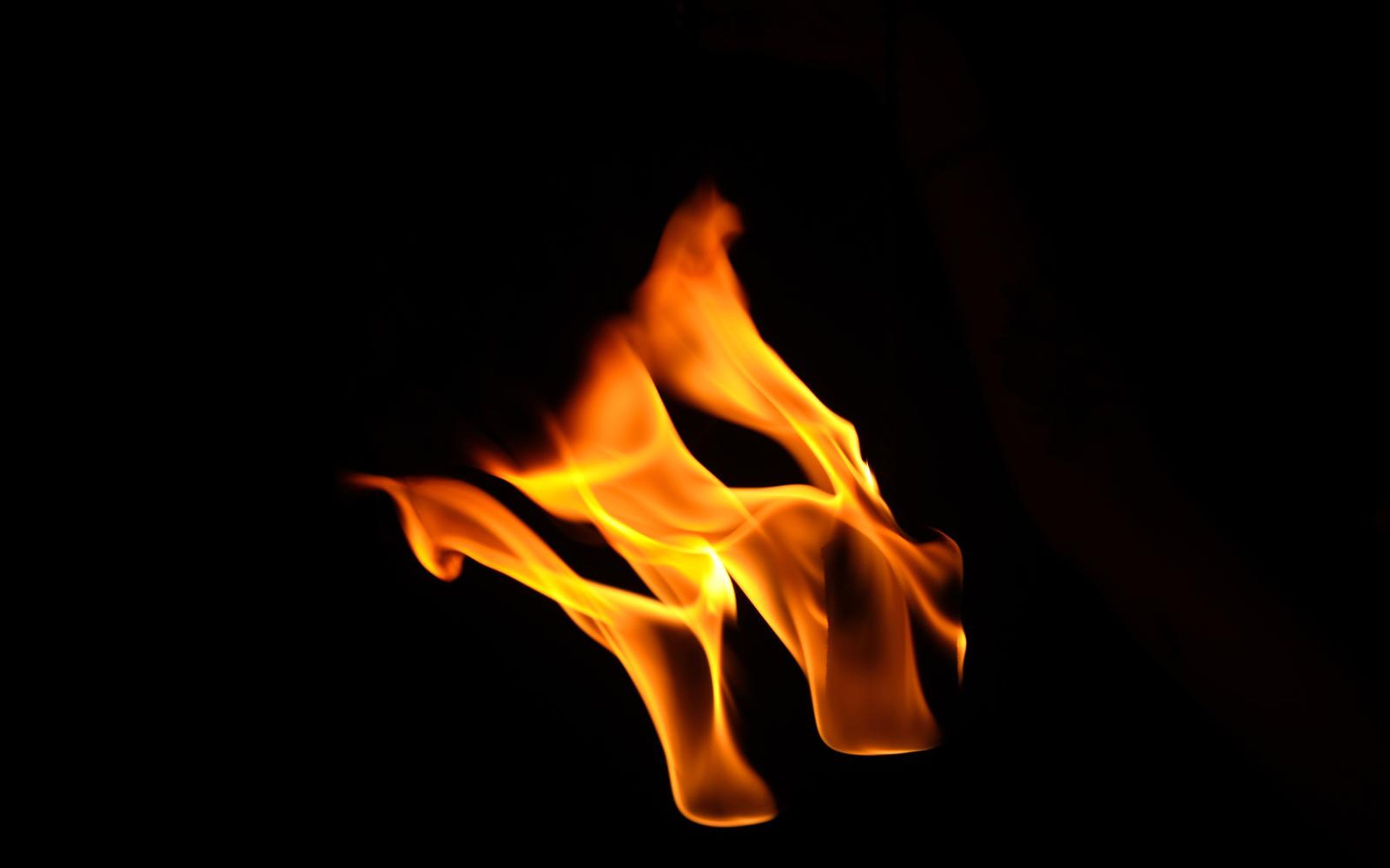 Flames sweeping diagonally to the right above two bases