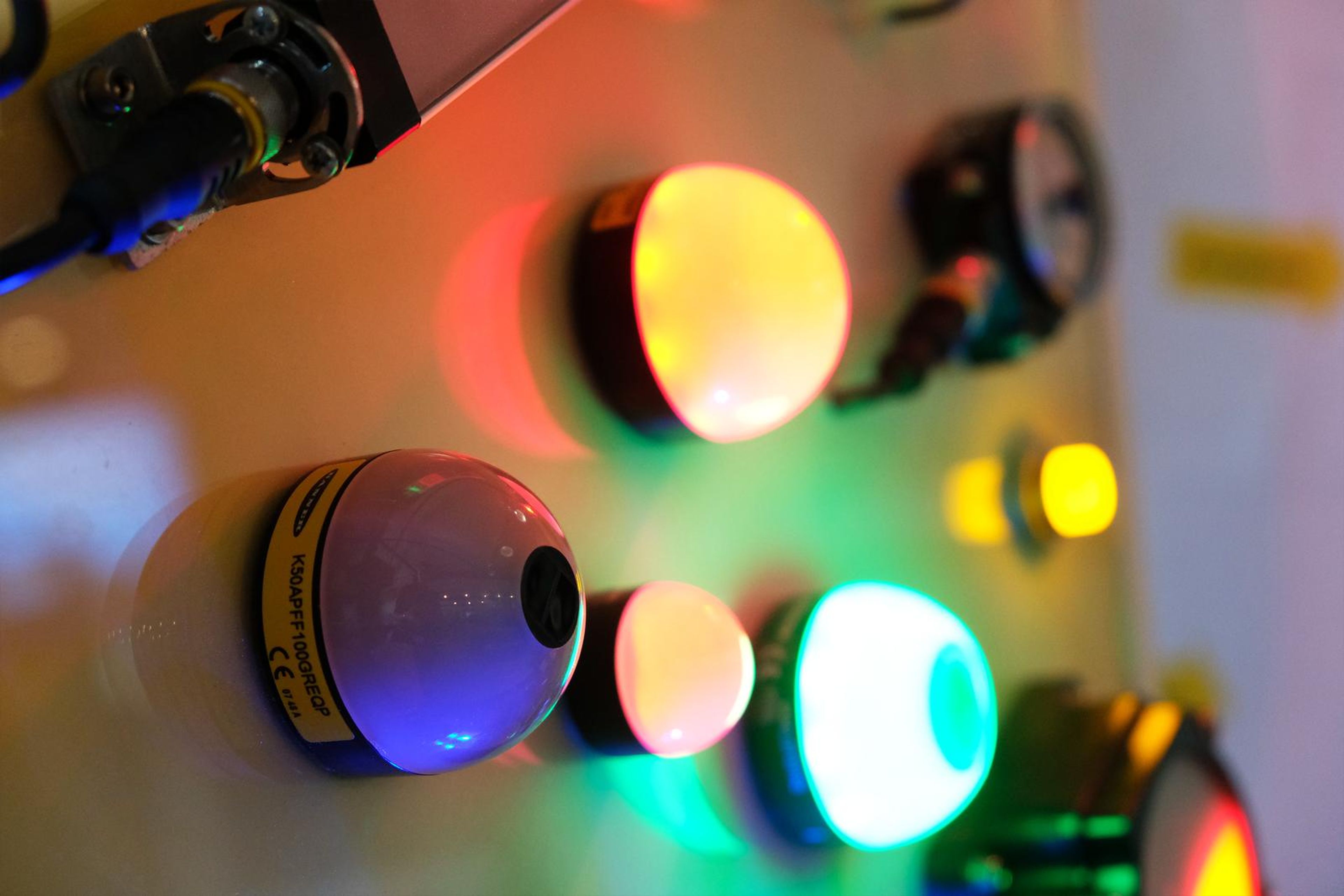 Coloured indicator lights glowing on a Turck demonstration panel
