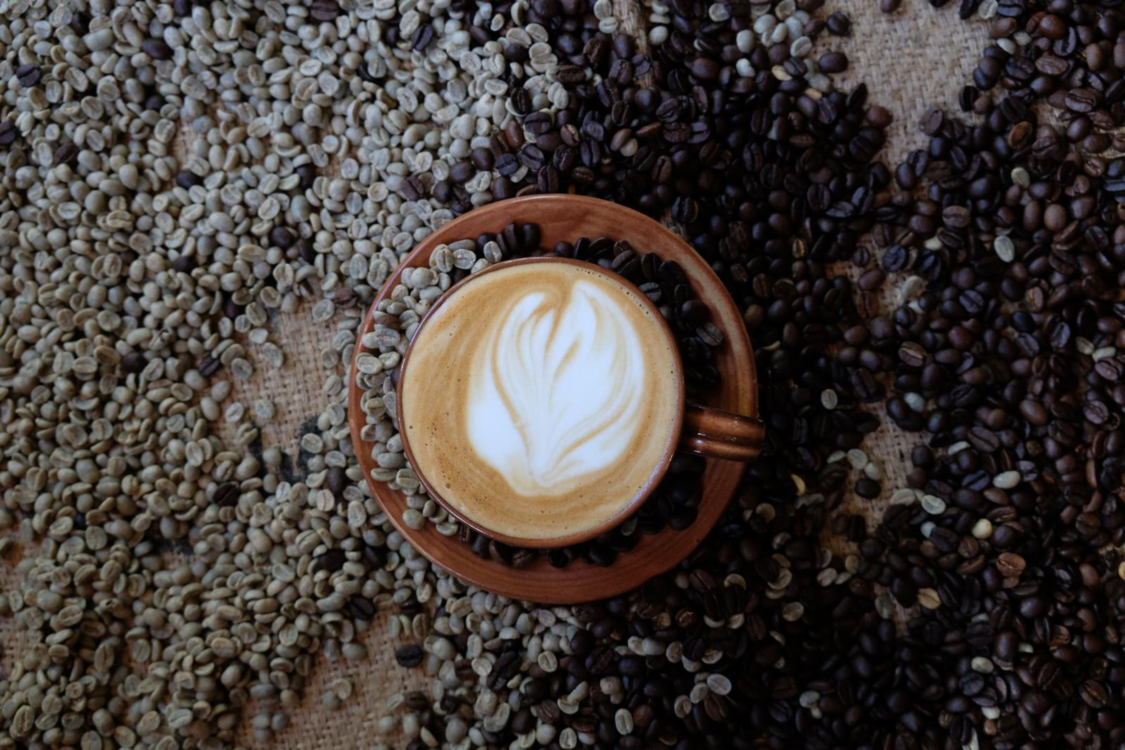 Death By Coffee creative product photography of coffee, beans and branded bags