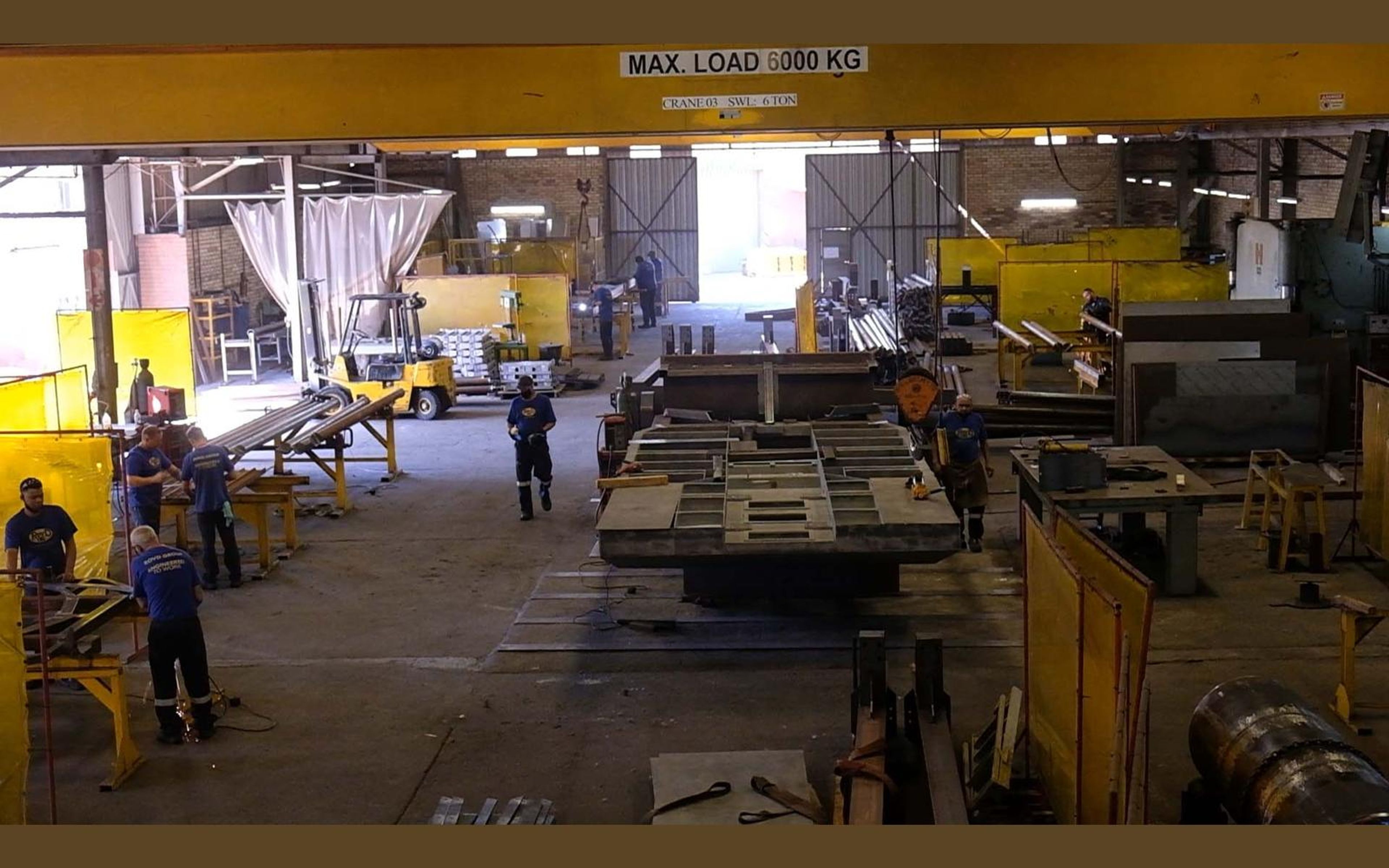 Overhead crane over steel frames in the fabrication bay
