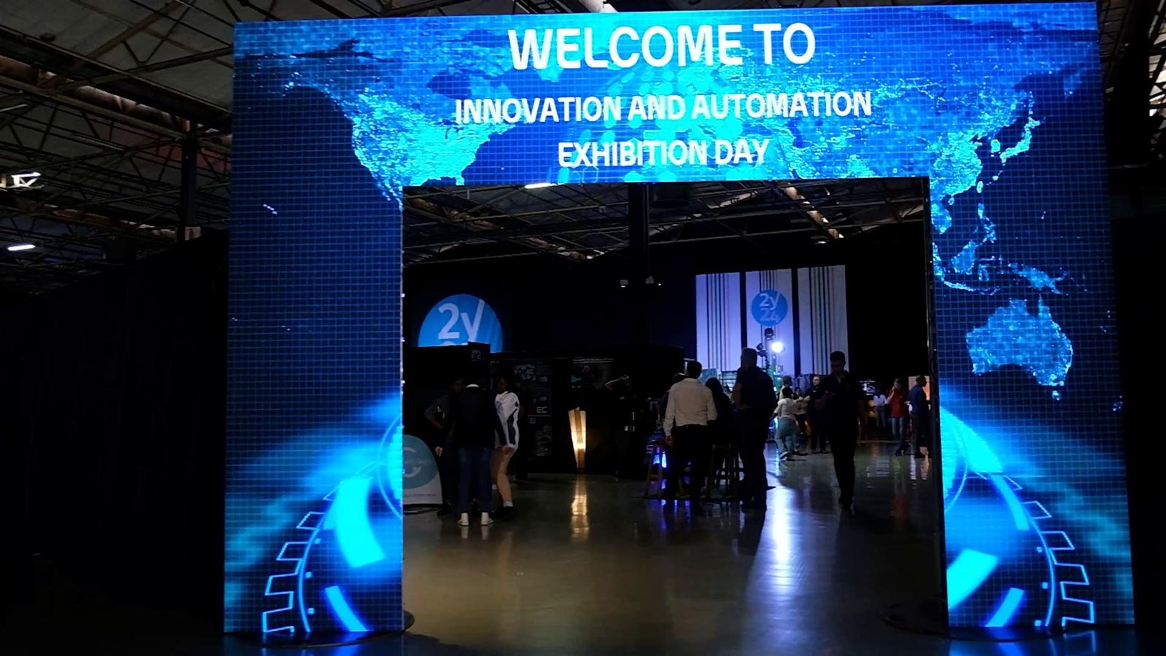 The welcome archway lit blue at the hall entrance