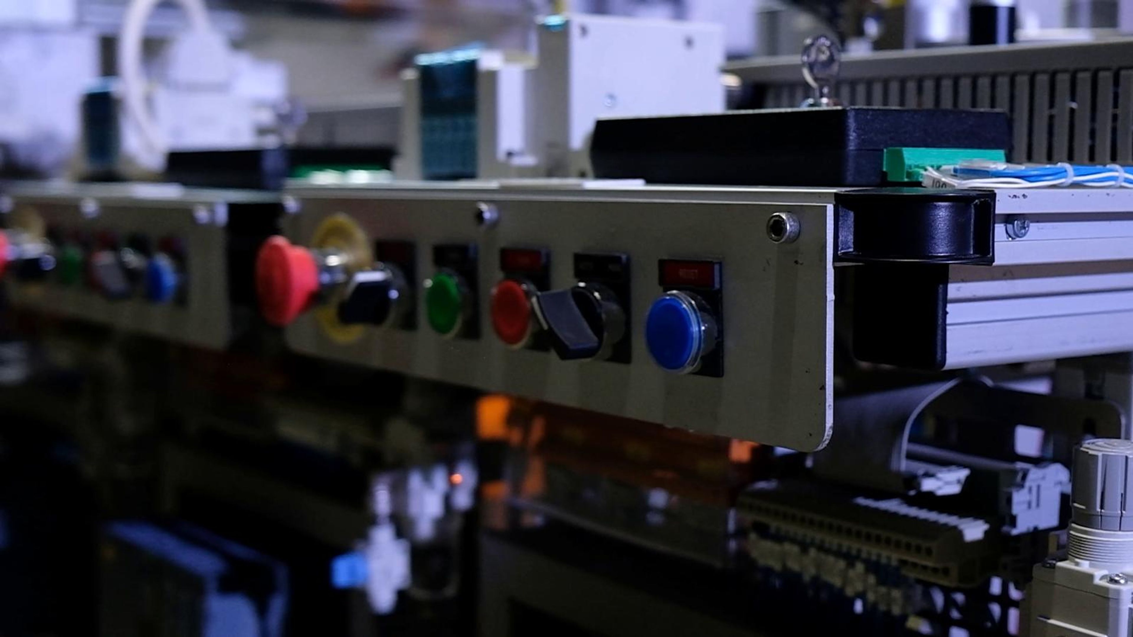 Low view along a row of control buttons