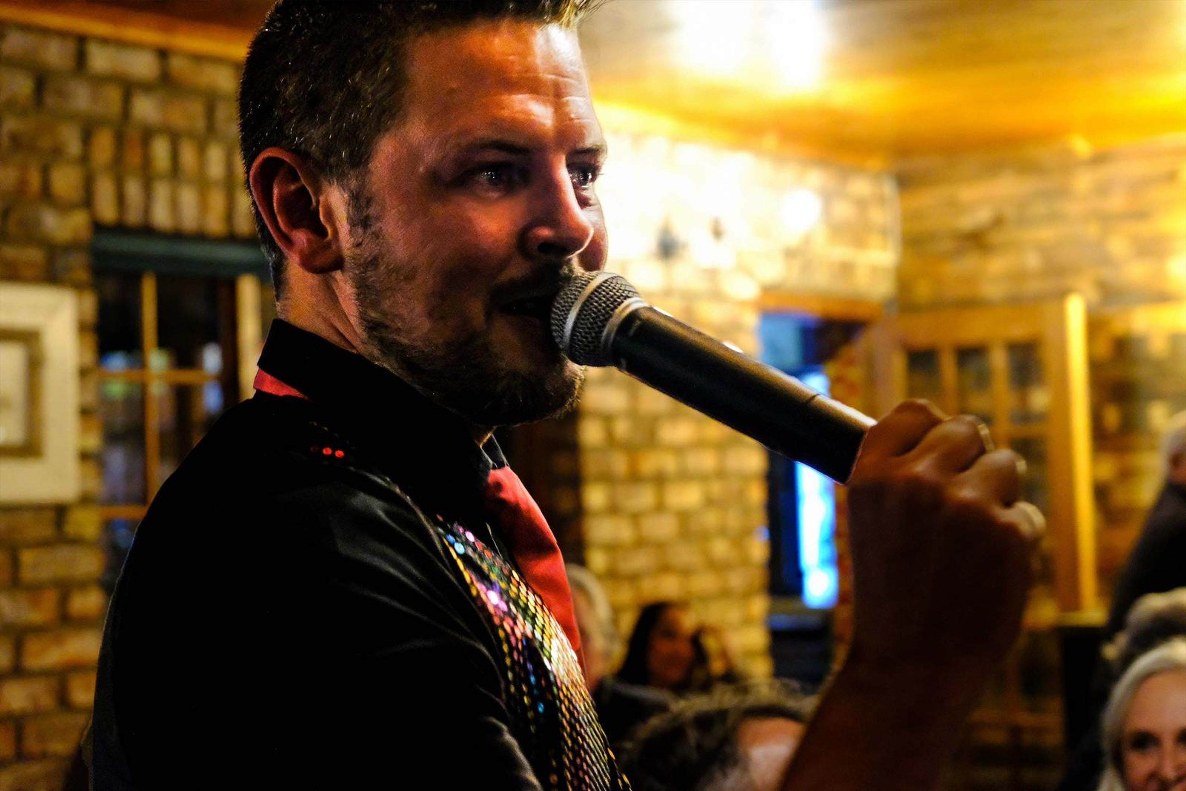 Close-up of the lead singer singing into the microphone