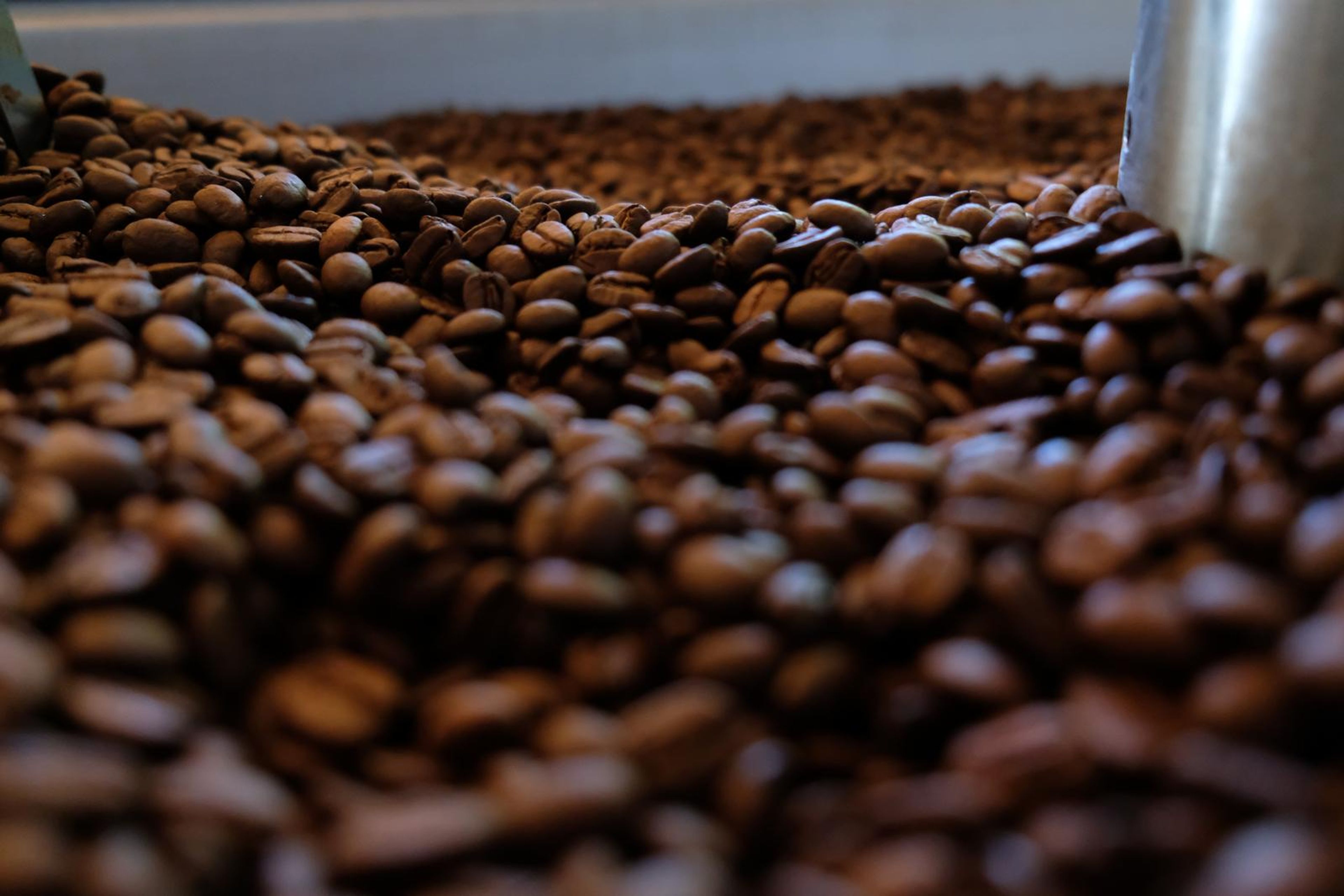 Death By Coffee creative product photography of coffee, beans and branded bags