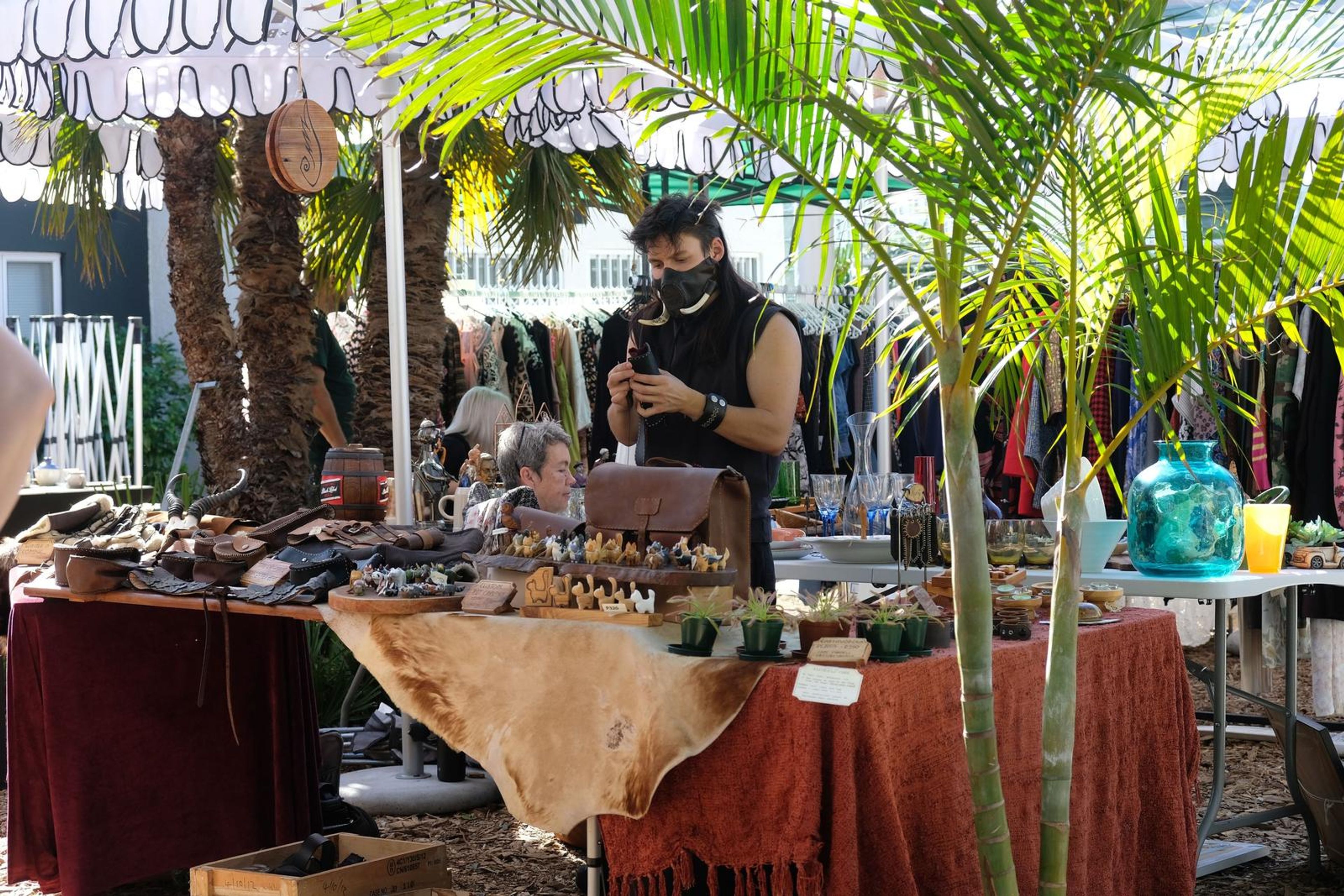Juuks maker at the stall under the palm trees at Filthy McNasty's market