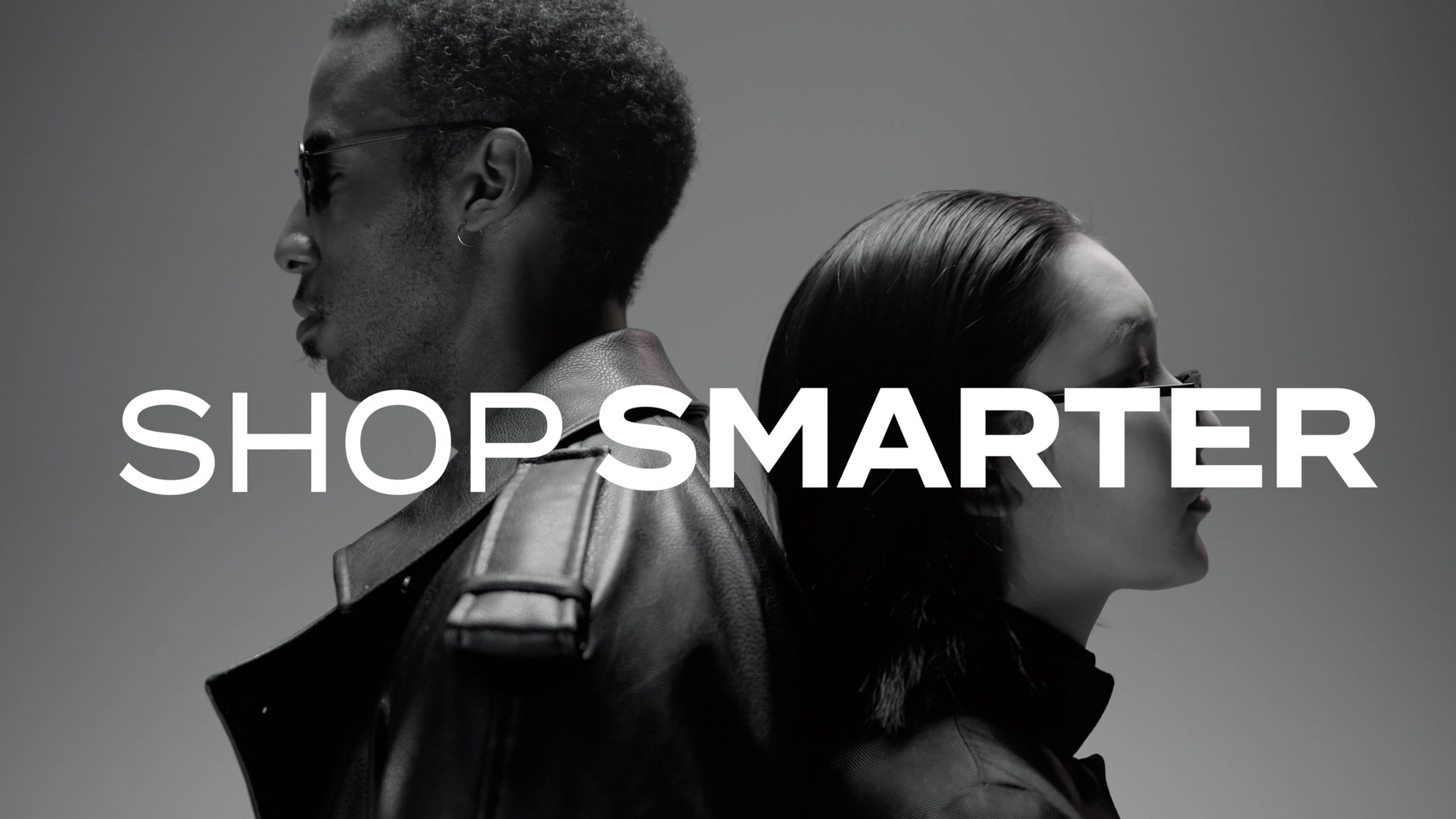 Two men in profile in black leather jackets, with the text 'Shop smarter'