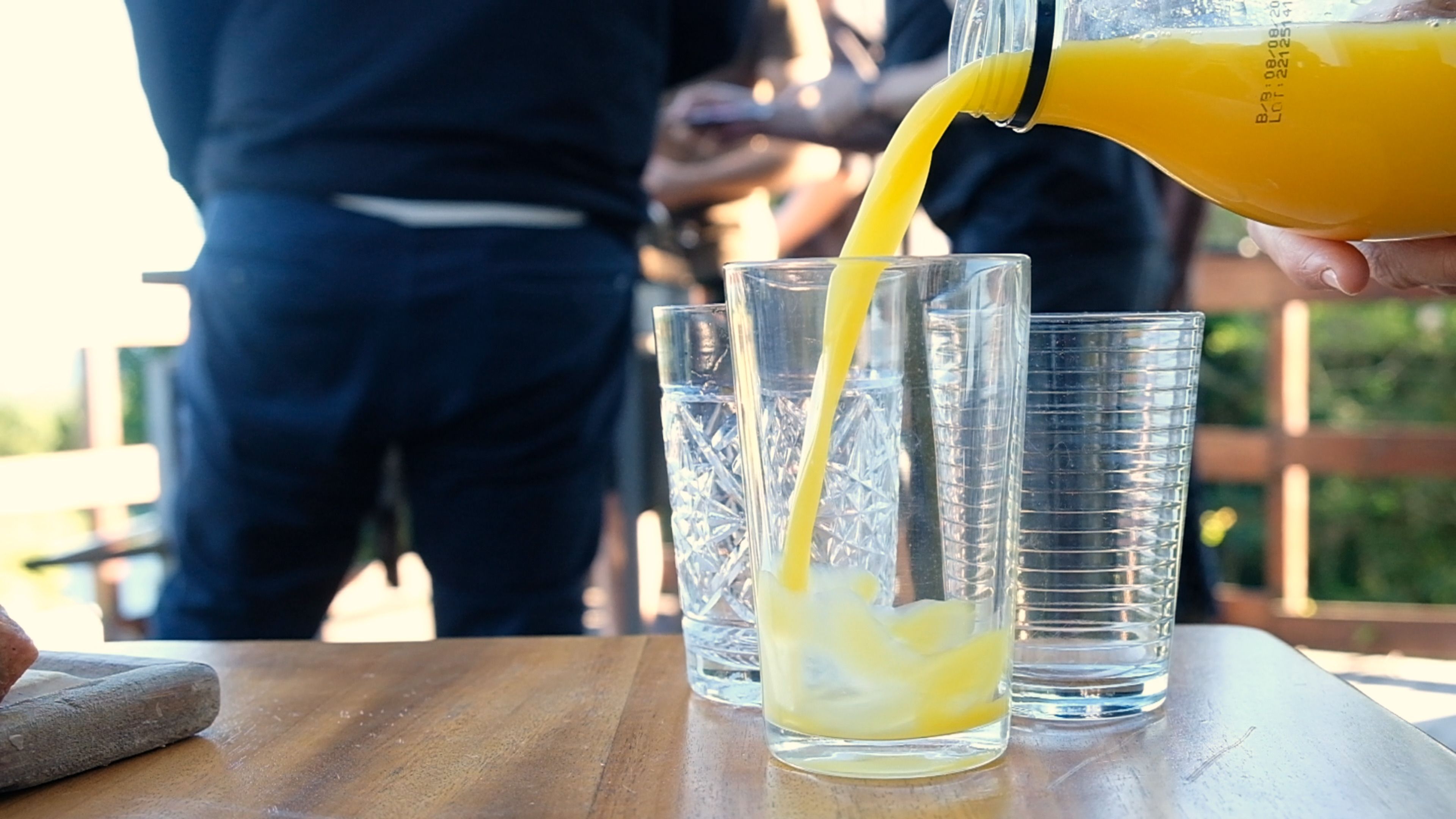 Orange juice being poured into a glass