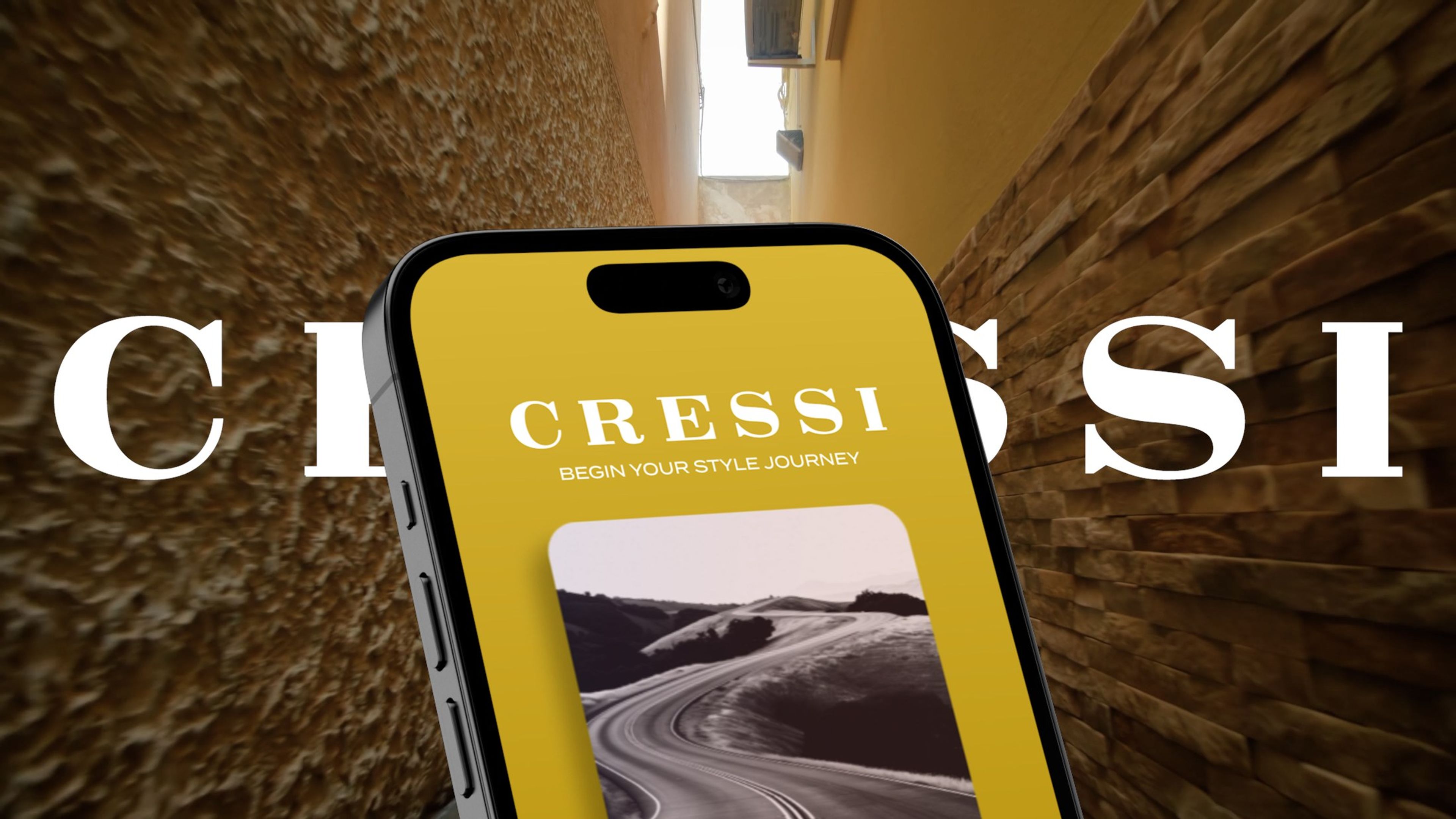 Gold CRESSI app splash screen on a phone in front of the CRESSI wordmark