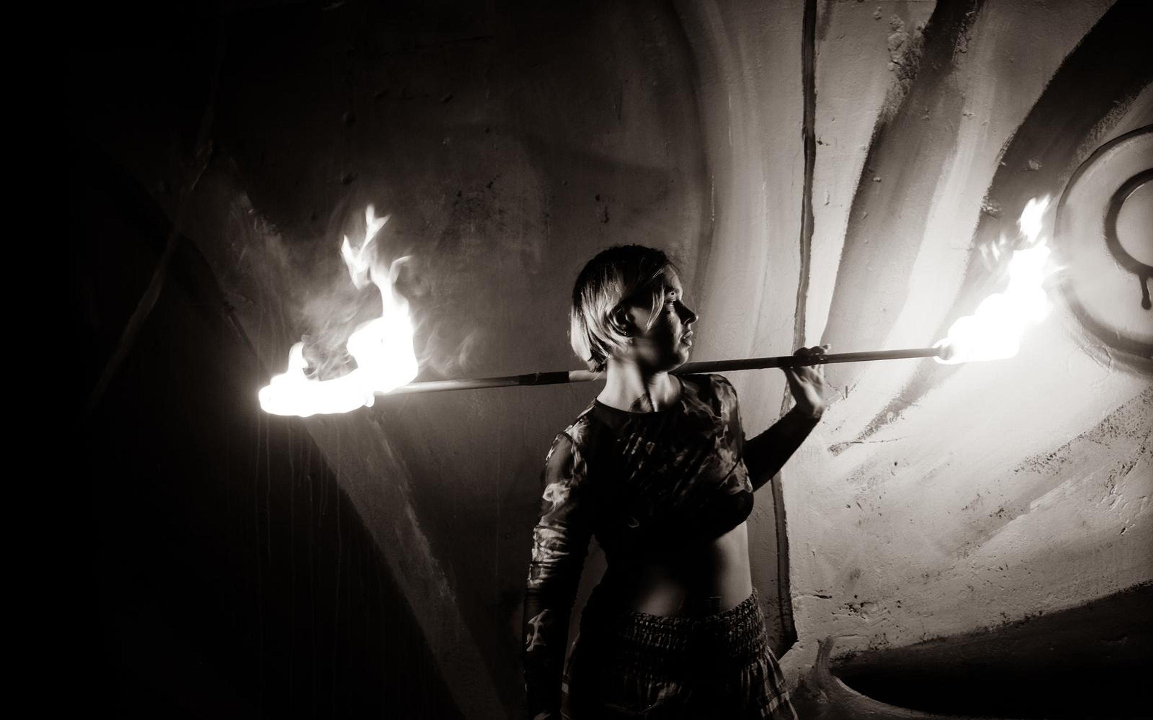Black and white version of the profile with a fire staff behind the shoulders