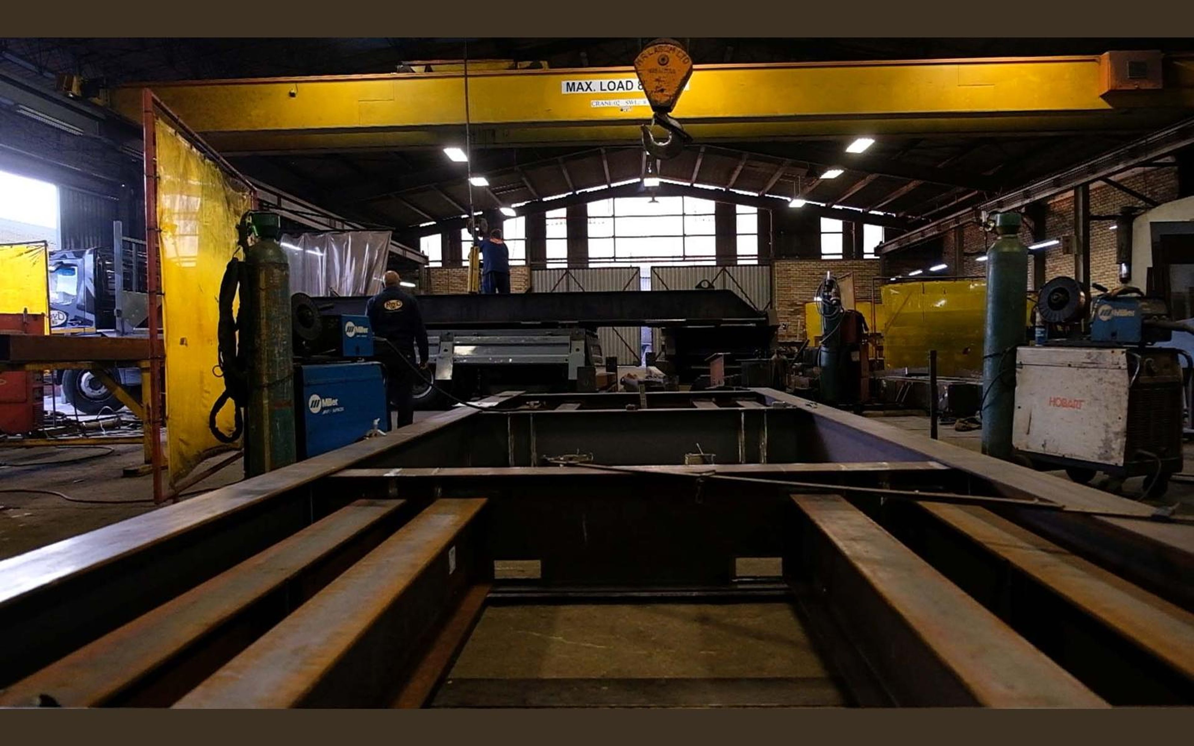 Overhead crane over steel frames in the fabrication bay