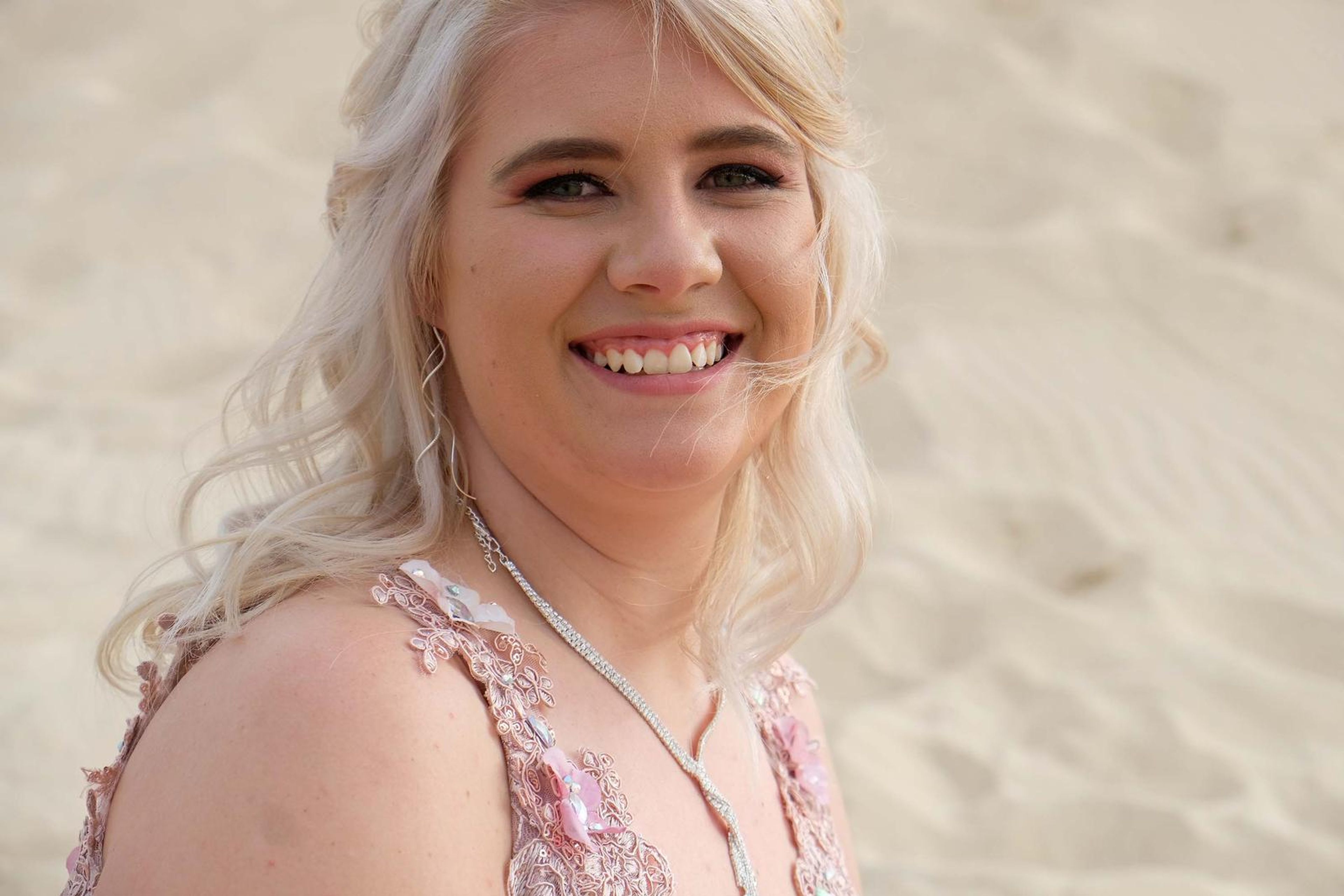 Close smiling portrait on the dune