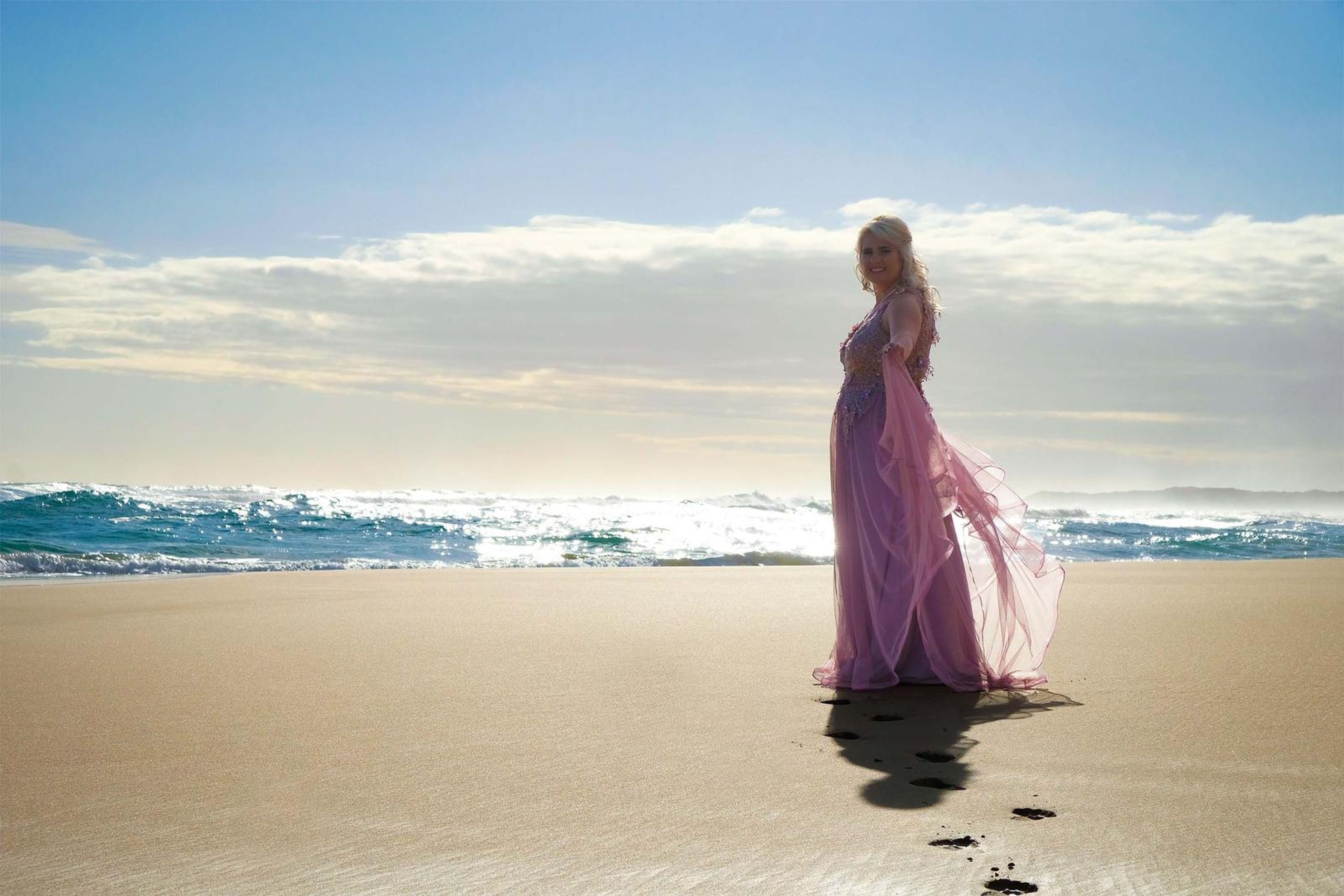 Standing on the shoreline in low sun