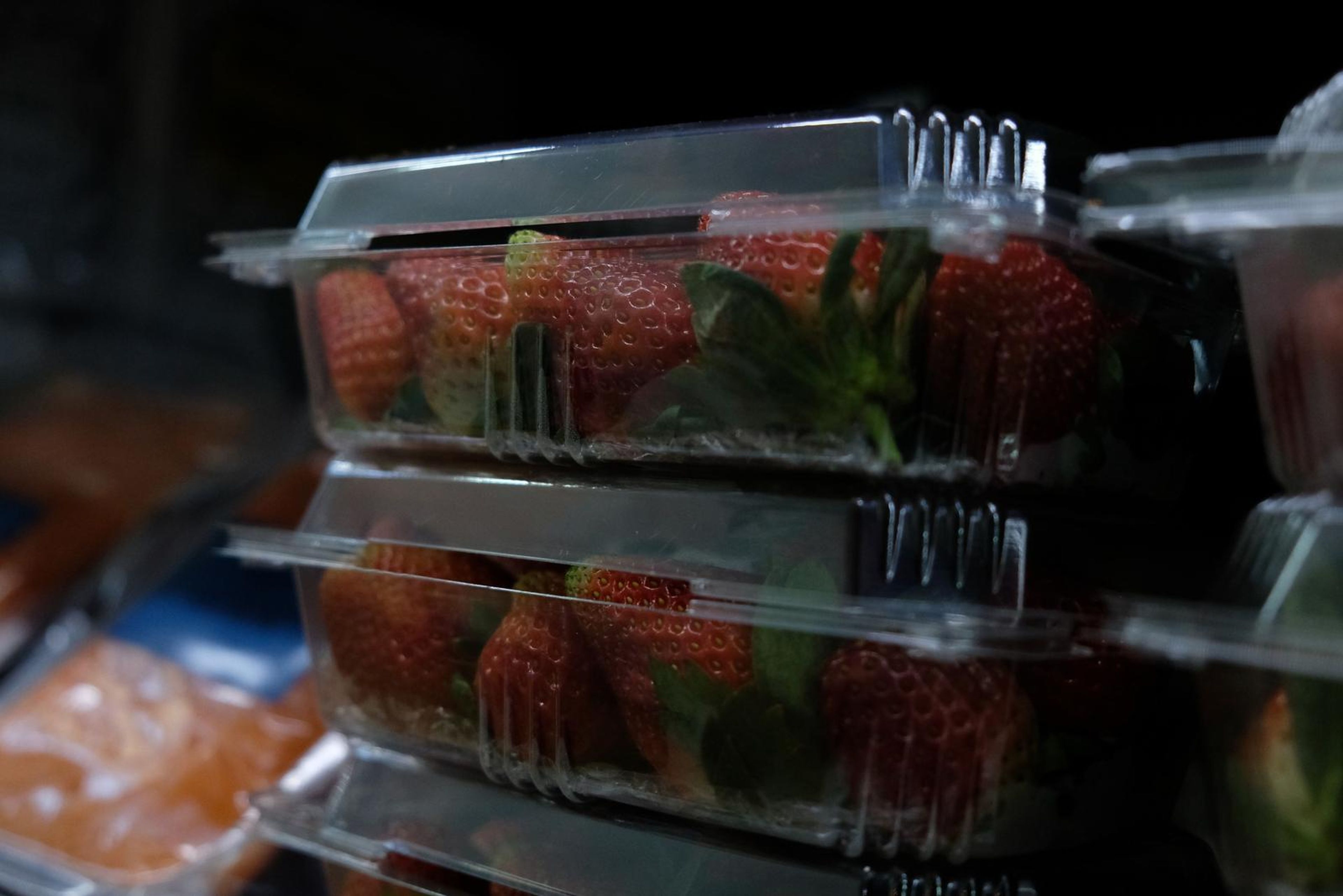 Stacked punnets of fresh strawberries