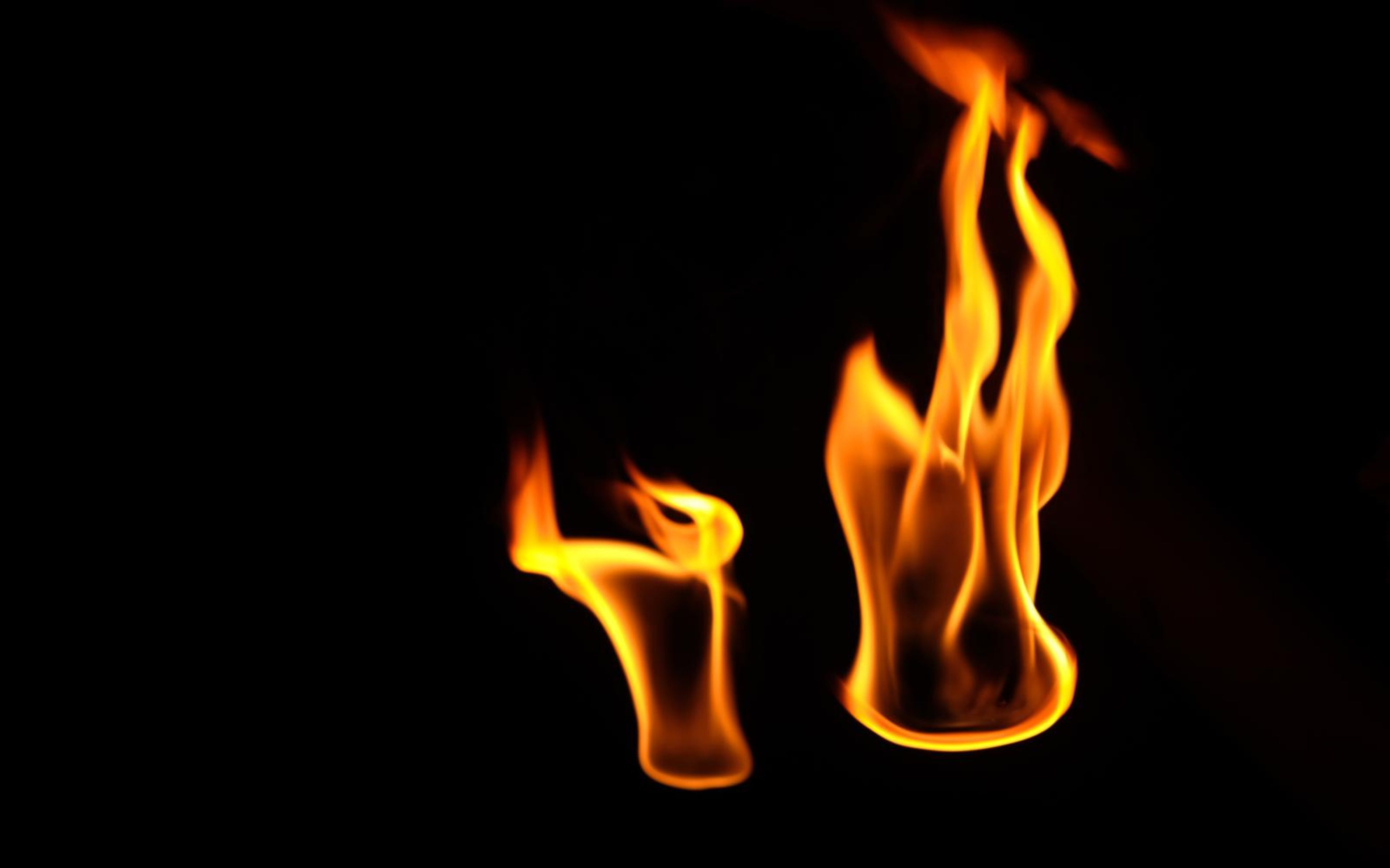Small flame at left beside a tall narrow flame at right