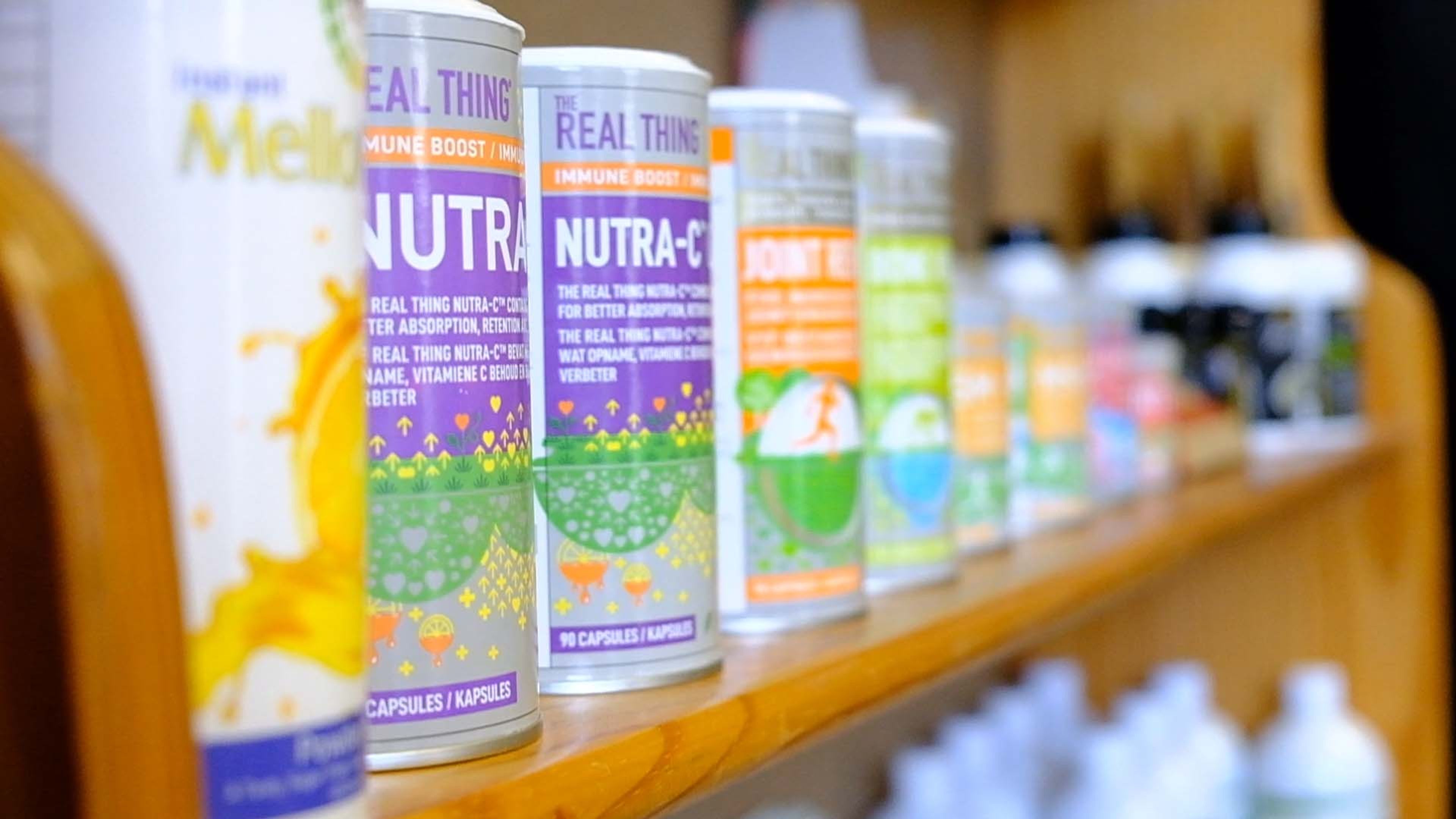 Cans of sparkling vitamin drinks and wellness products on a shelf