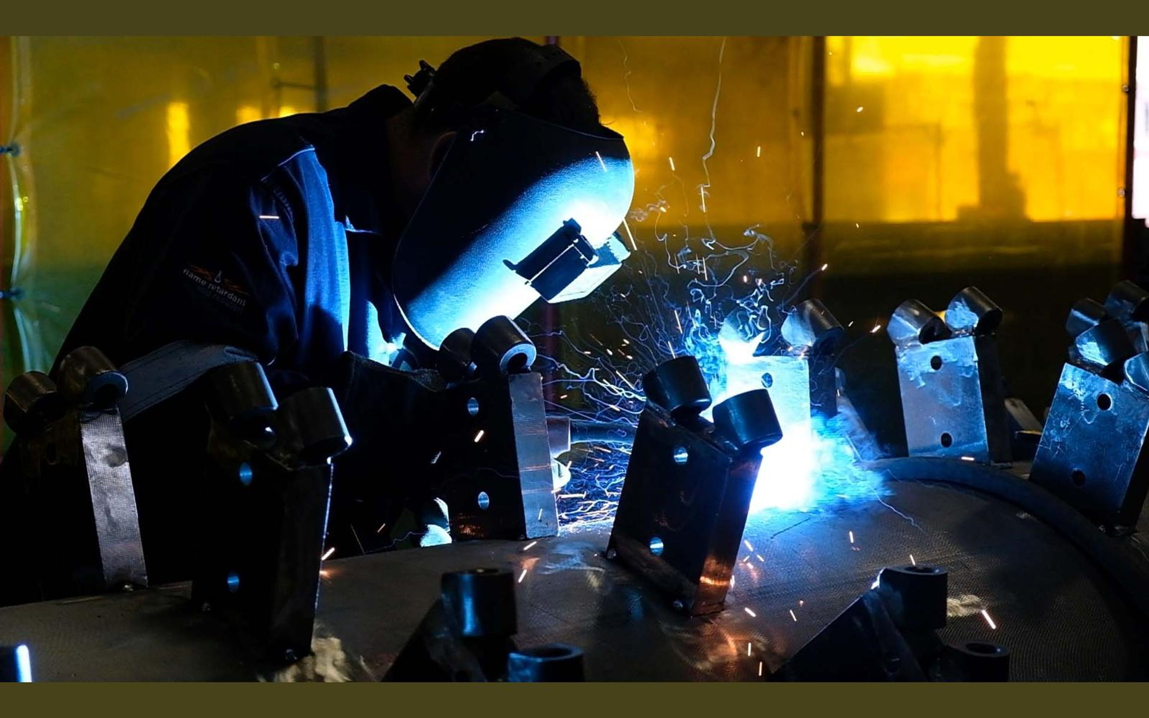 Welding smoke and sparks around mounting brackets