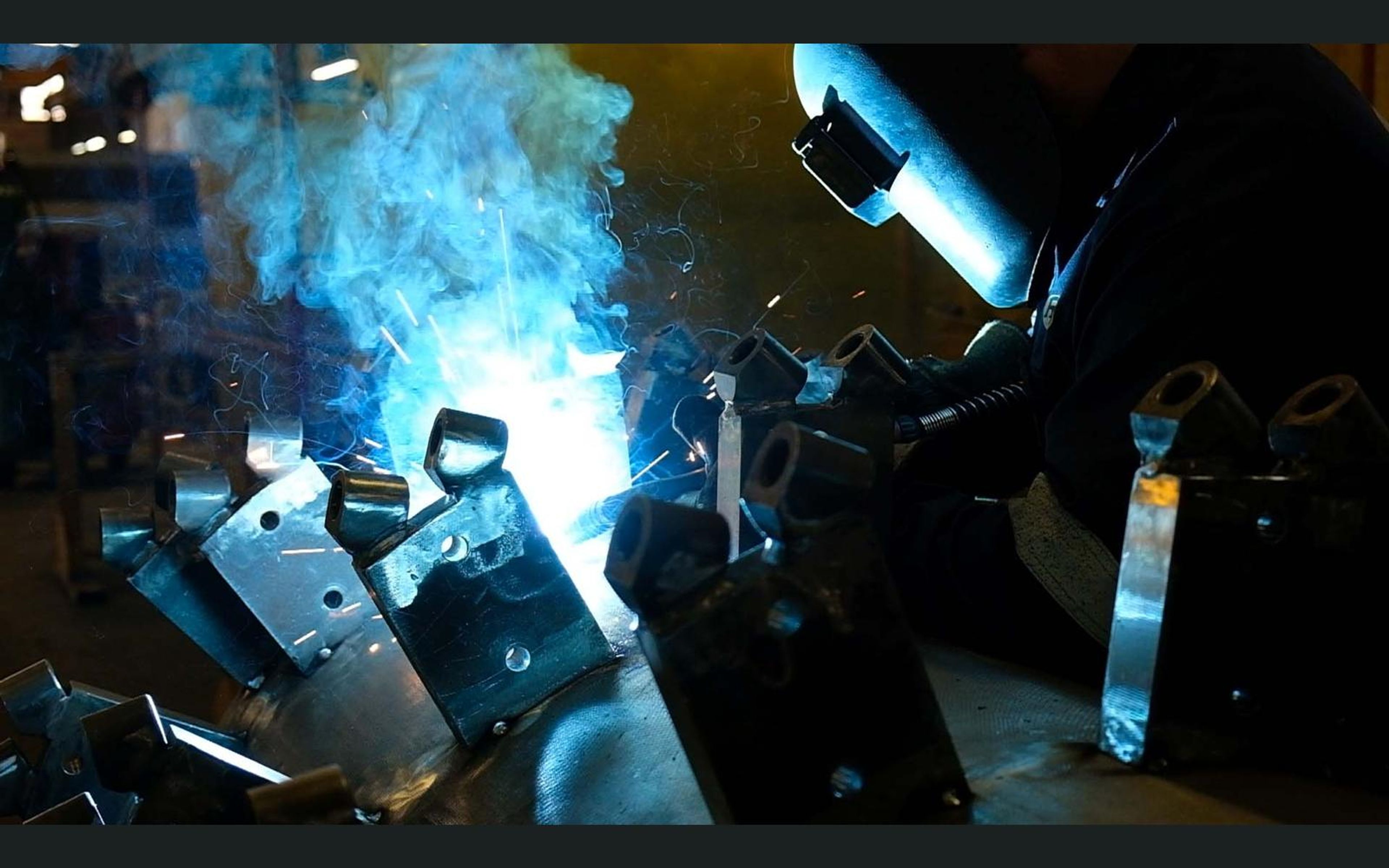 Welding smoke and sparks around mounting brackets
