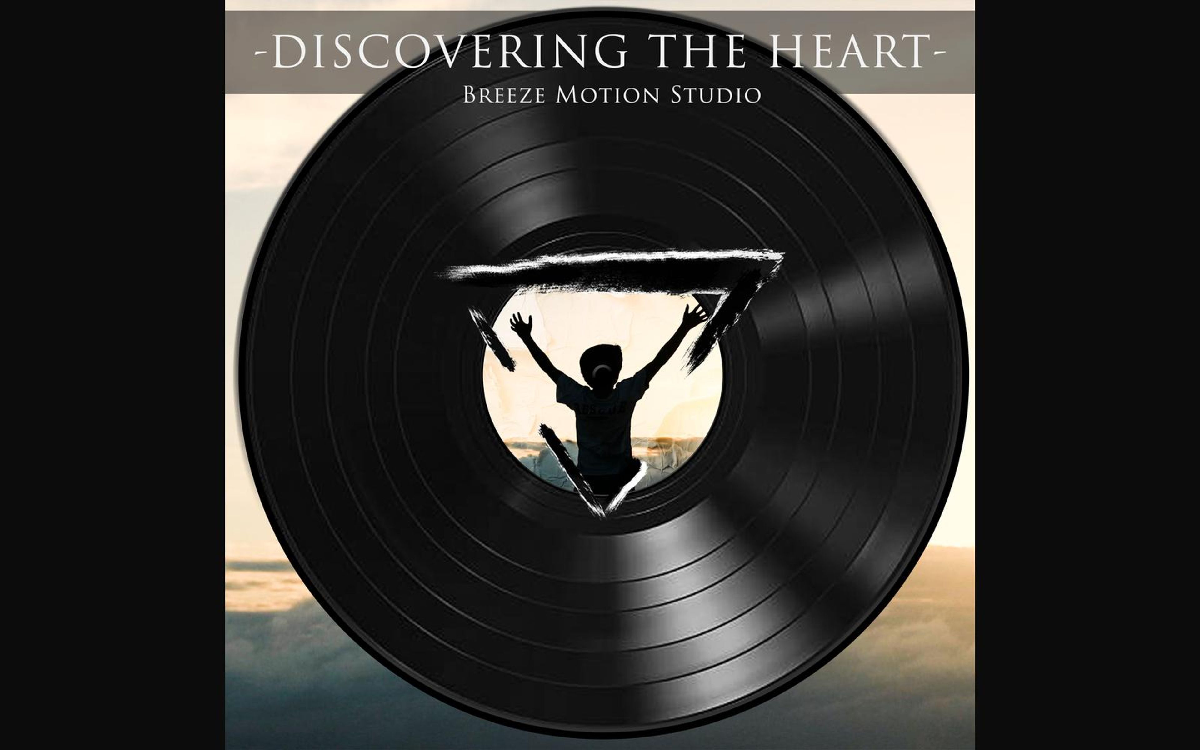 Black vinyl record graphic with a triangular cut-out showing a child silhouette with raised arms at sunrise