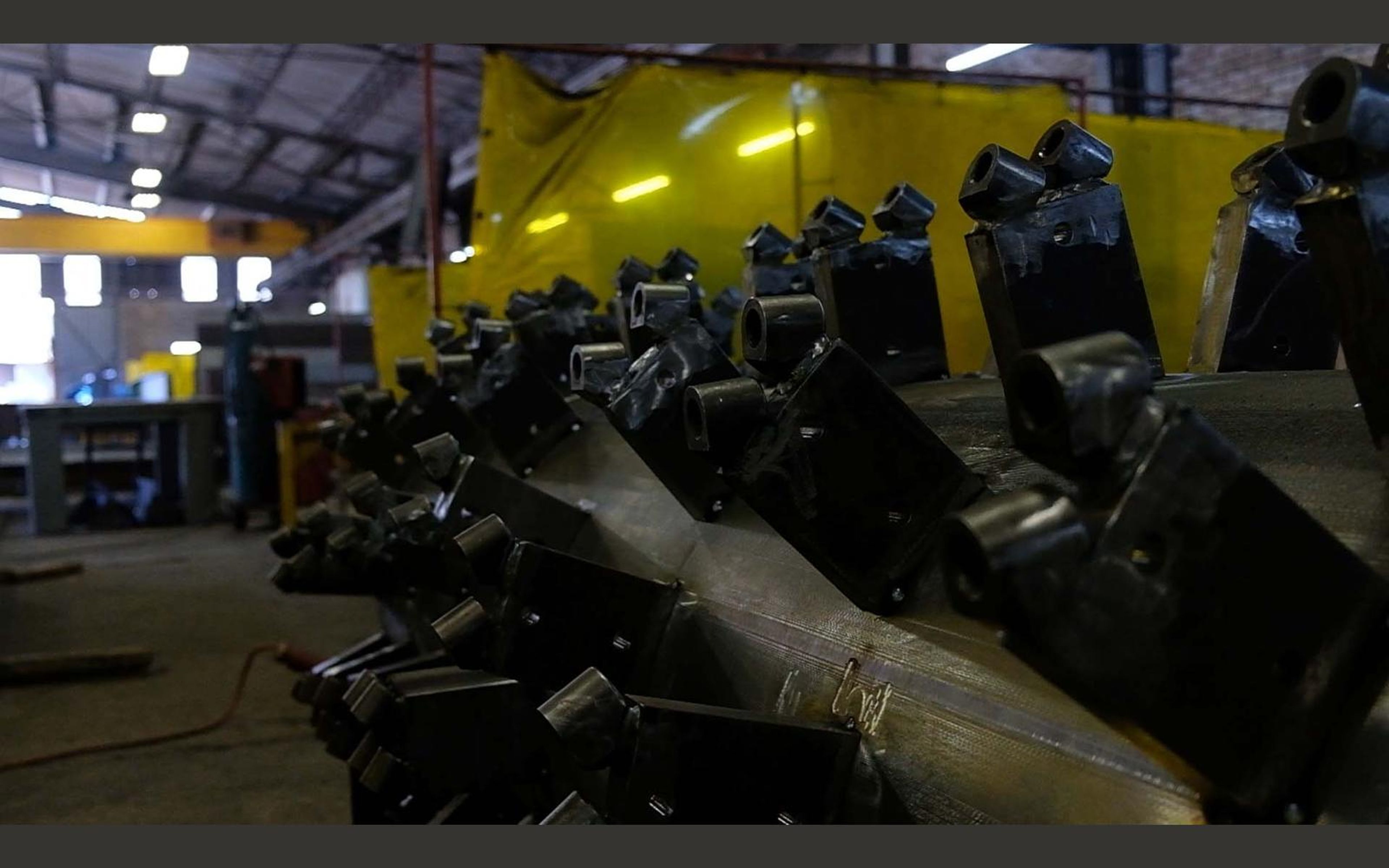 Welding smoke and sparks around mounting brackets
