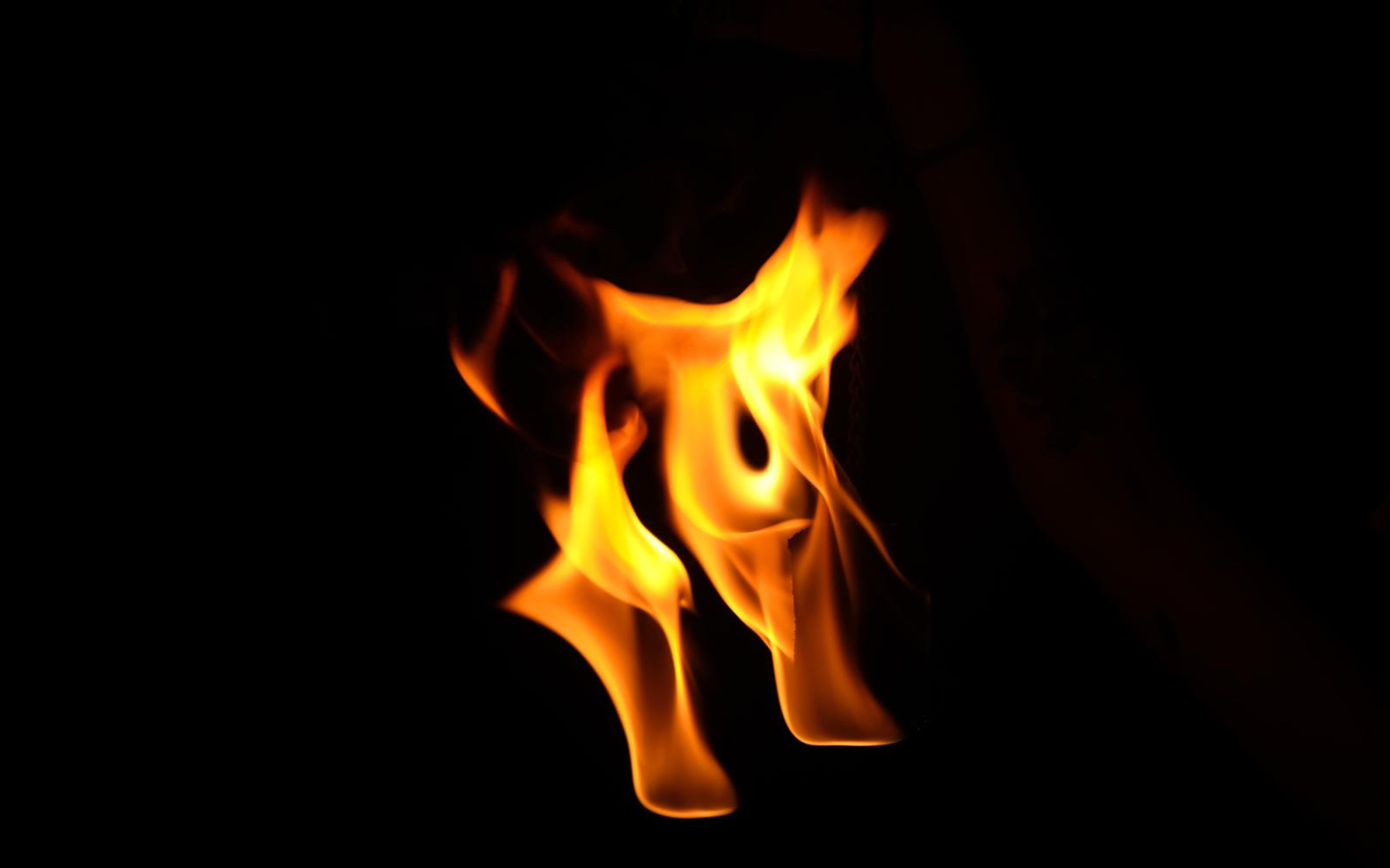 Swirling flame with a visible hollow loop in the centre