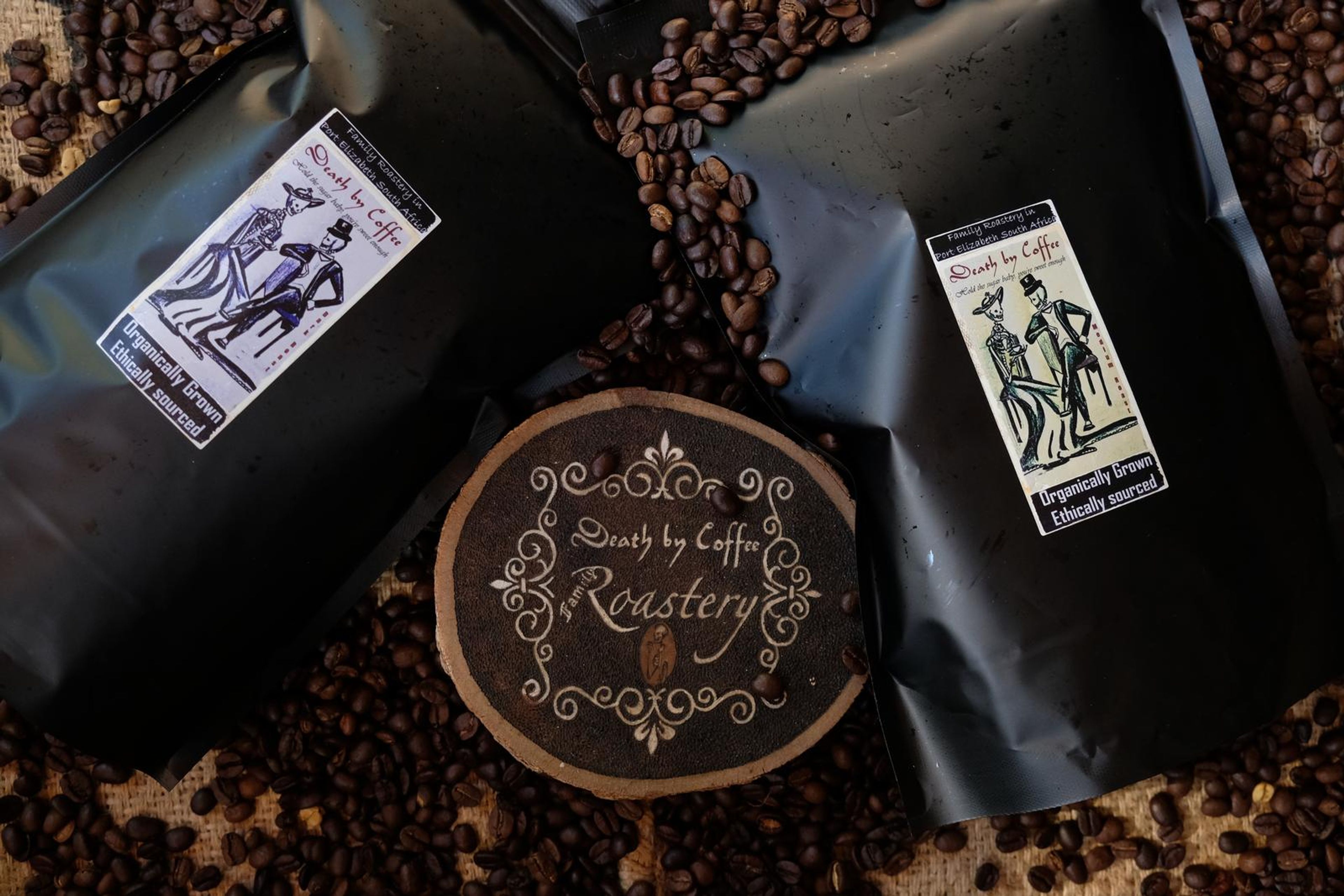 Death By Coffee creative product photography of coffee, beans and branded bags