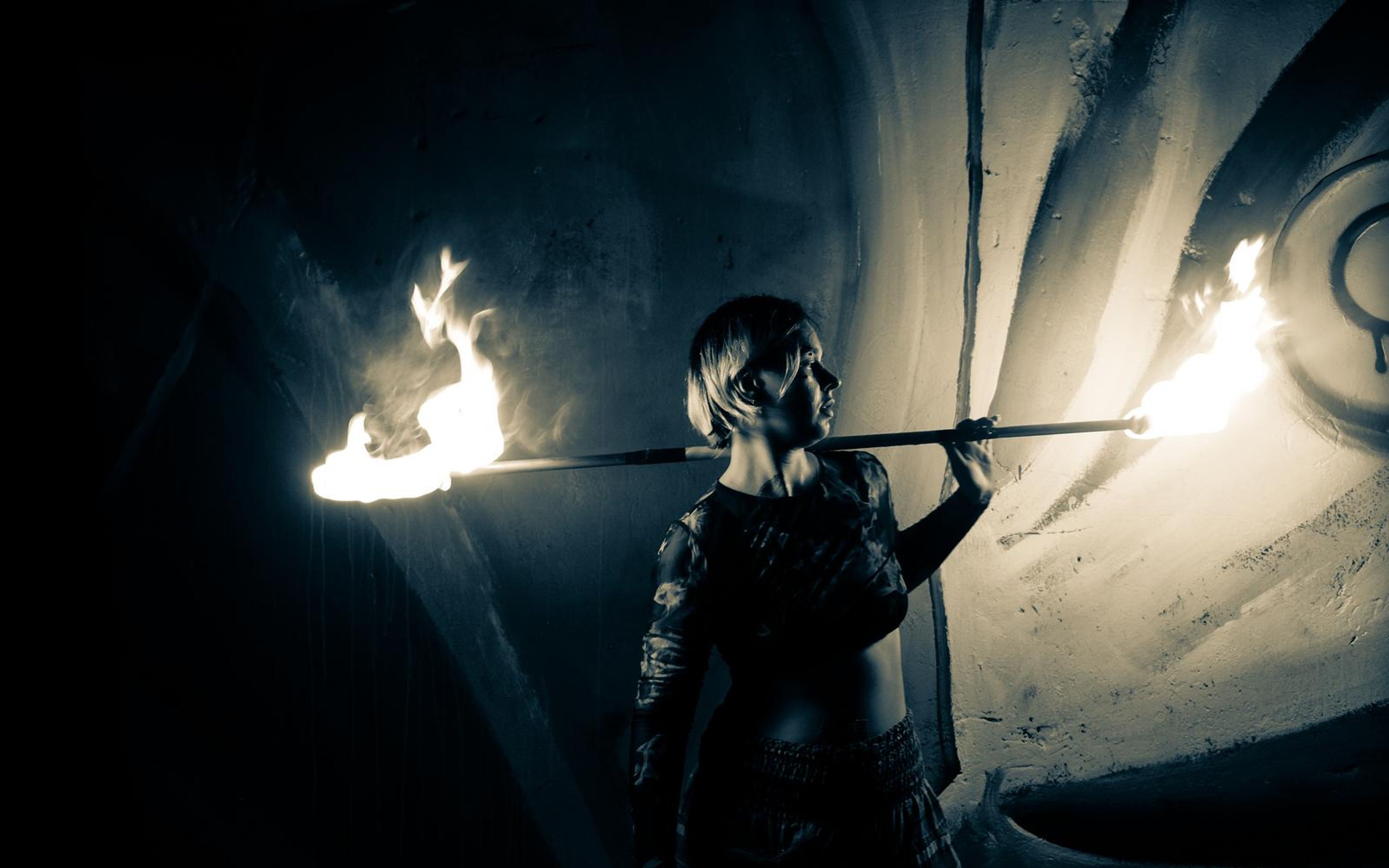 Blue-toned version of the profile with a fire staff behind the shoulders, the flames staying white