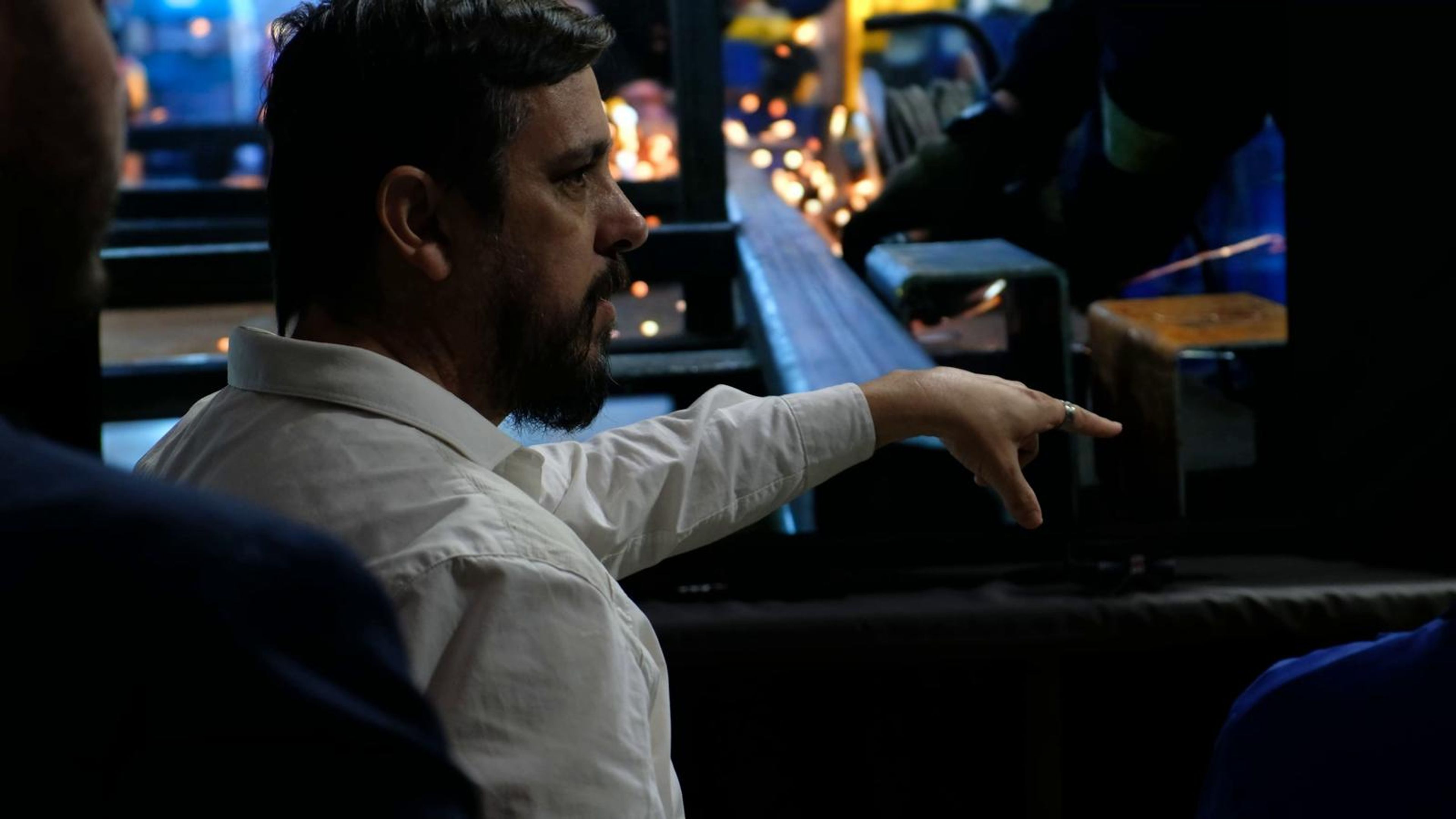 Two visitors watching simulation screens at the stall