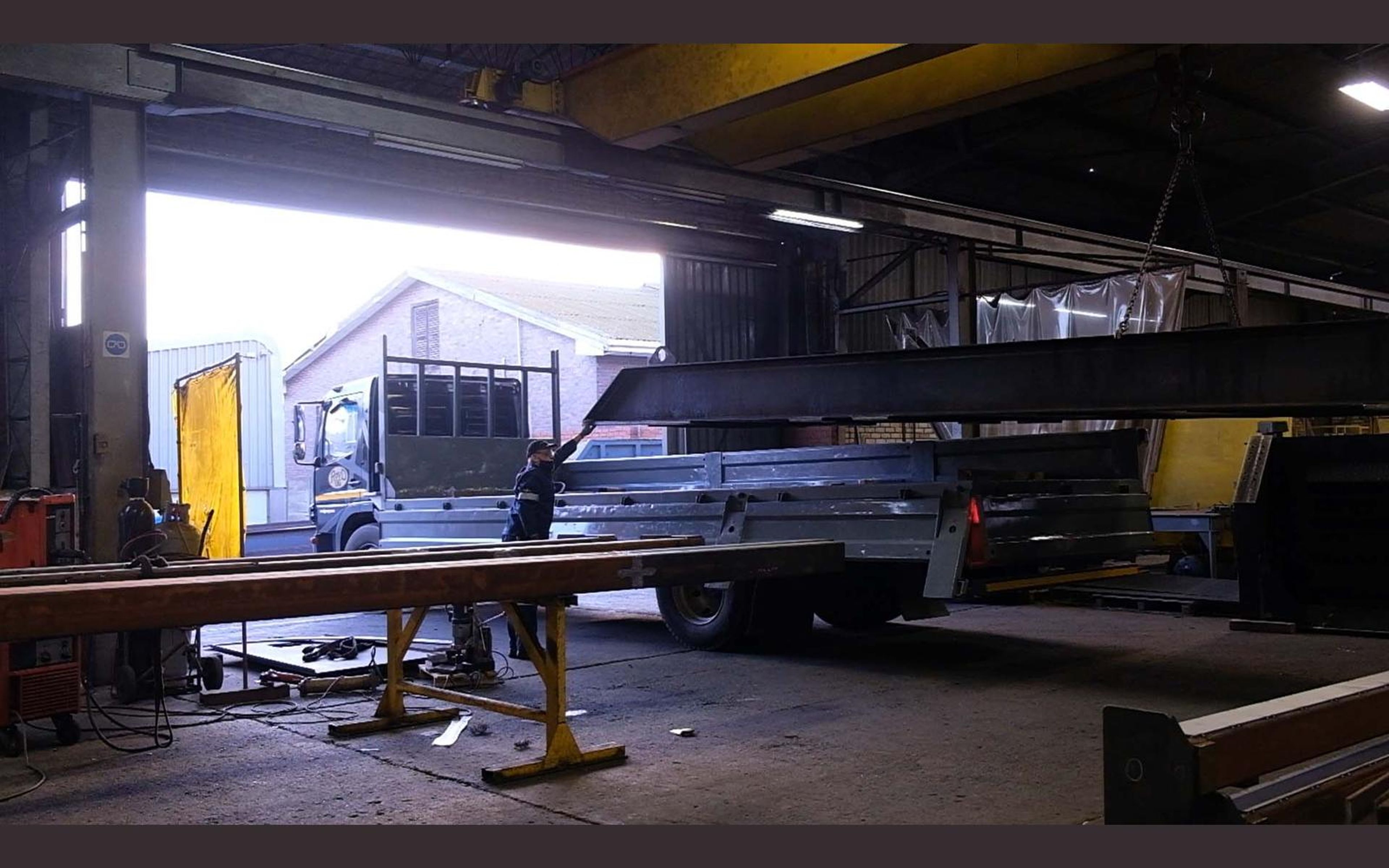 Steel frames laid out across the fabrication sector floor