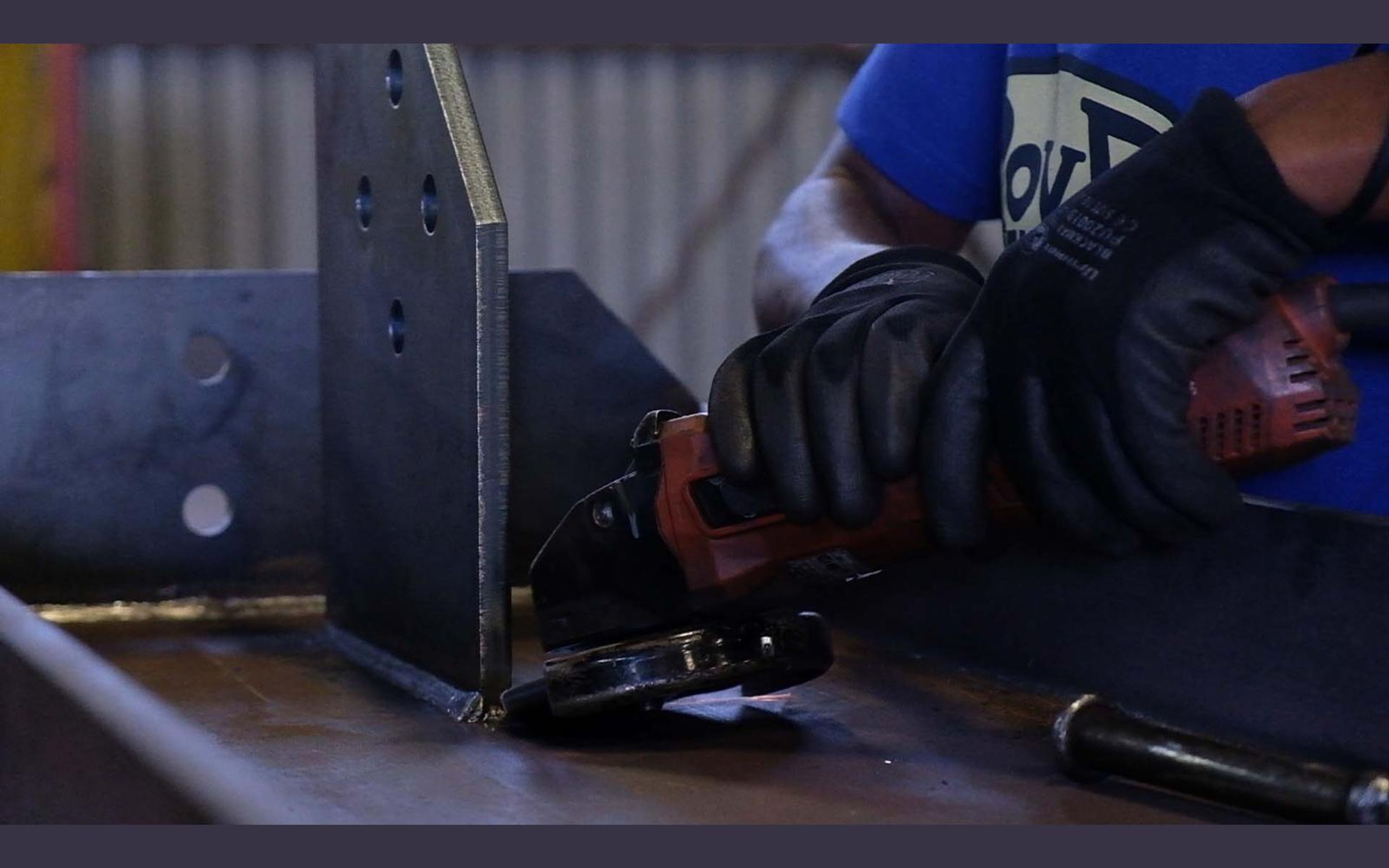 Welder at work with sparks and arc light