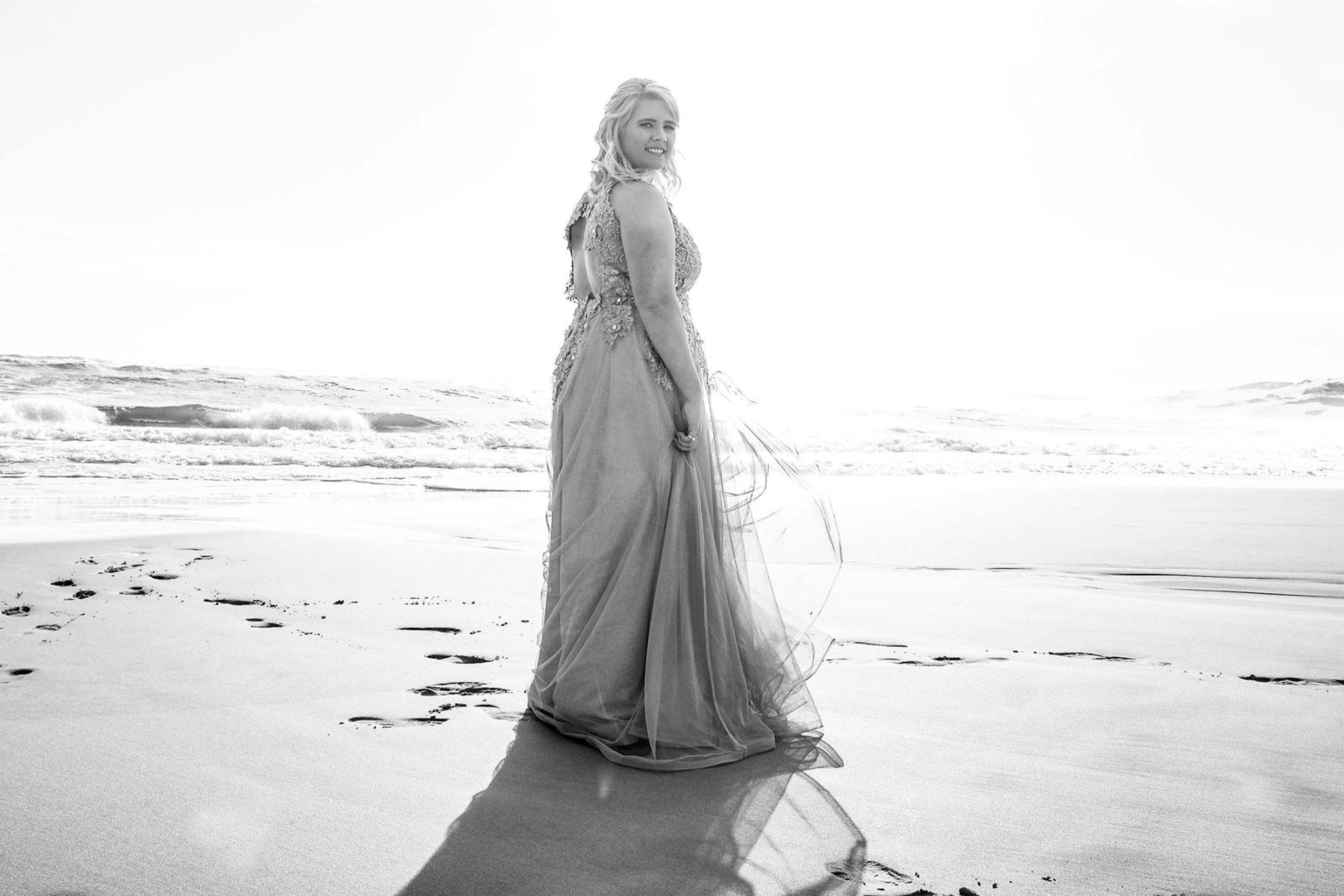 Black and white backlit portrait on the beach