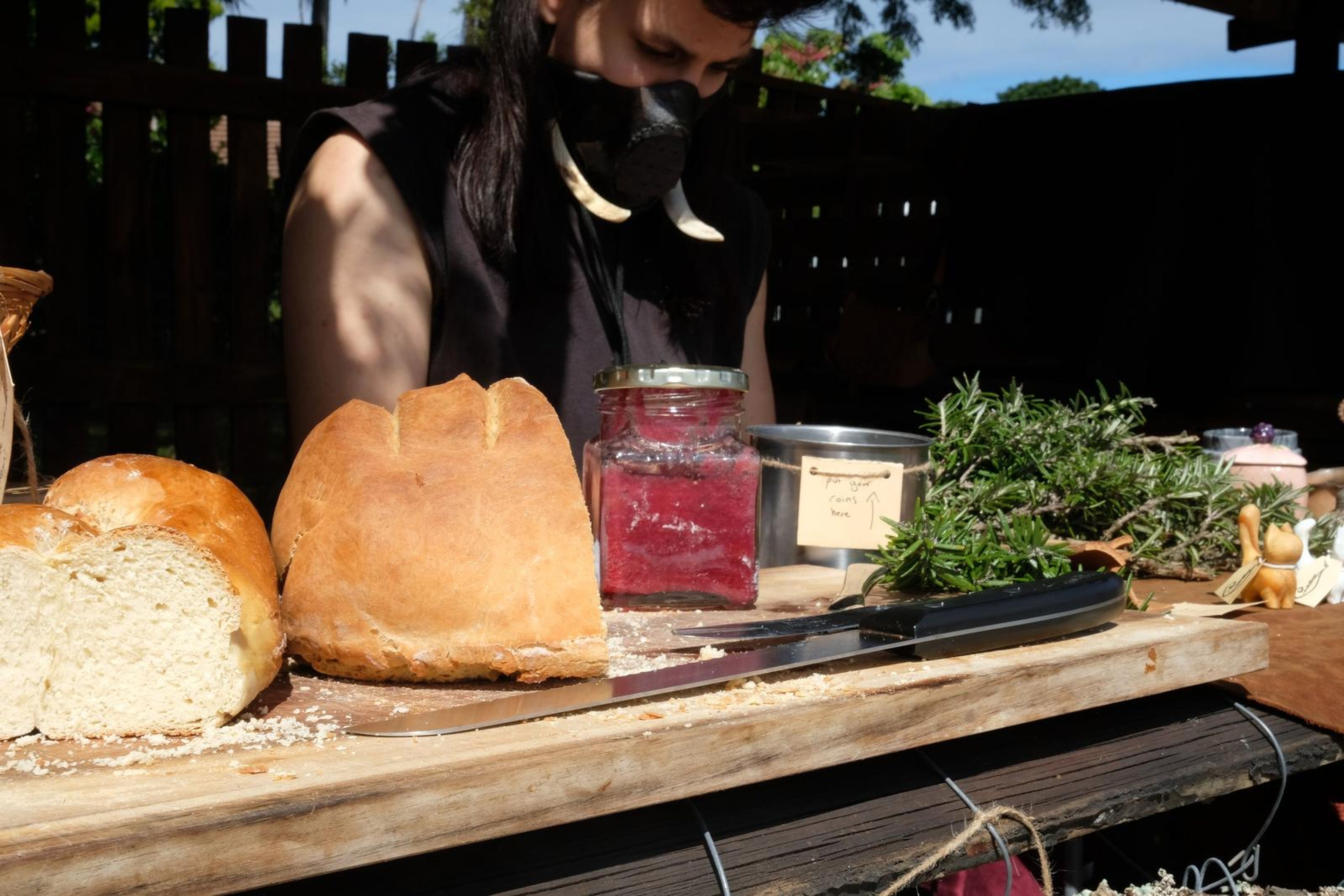 Neighbouring stall table with bread, jam and herbs at Windsong Boho market