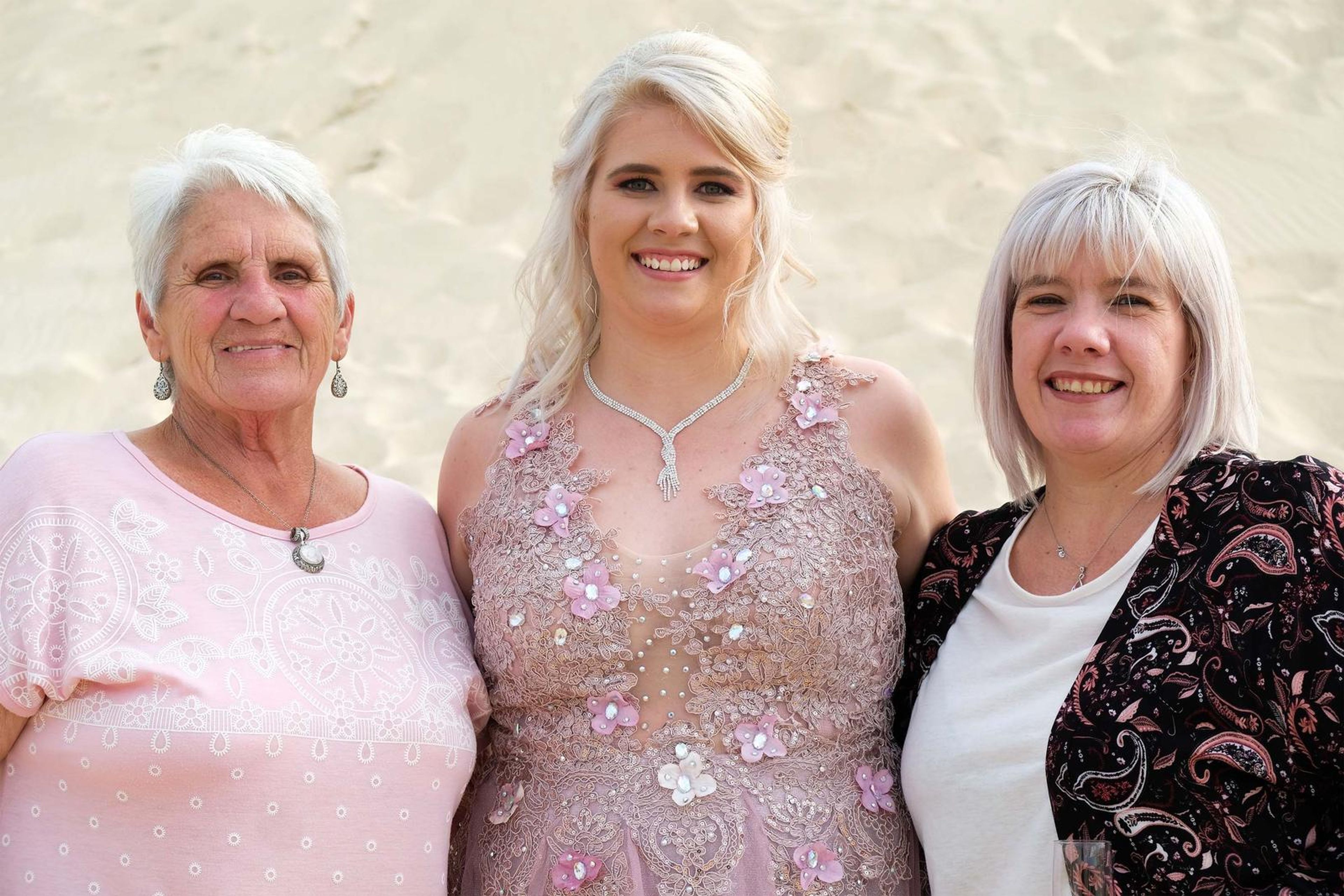 Close family portrait, three generations smiling