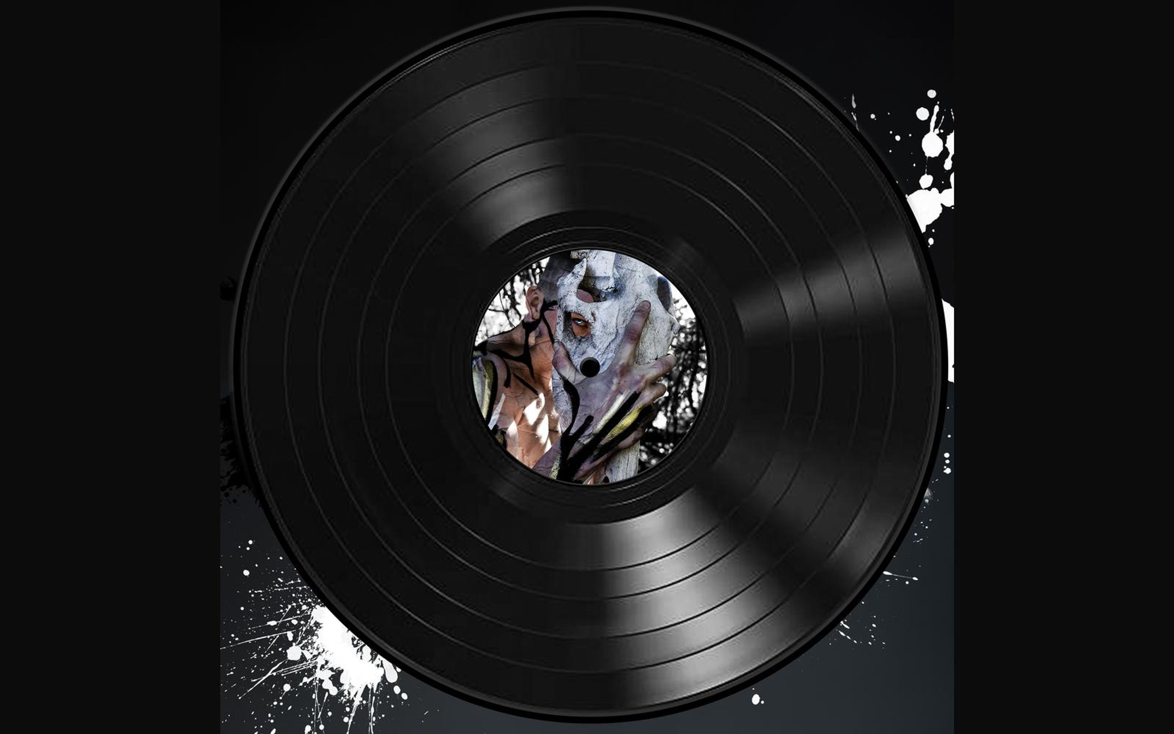 Vinyl record sleeve with a weathered stone-like face in earth tones on the centre label