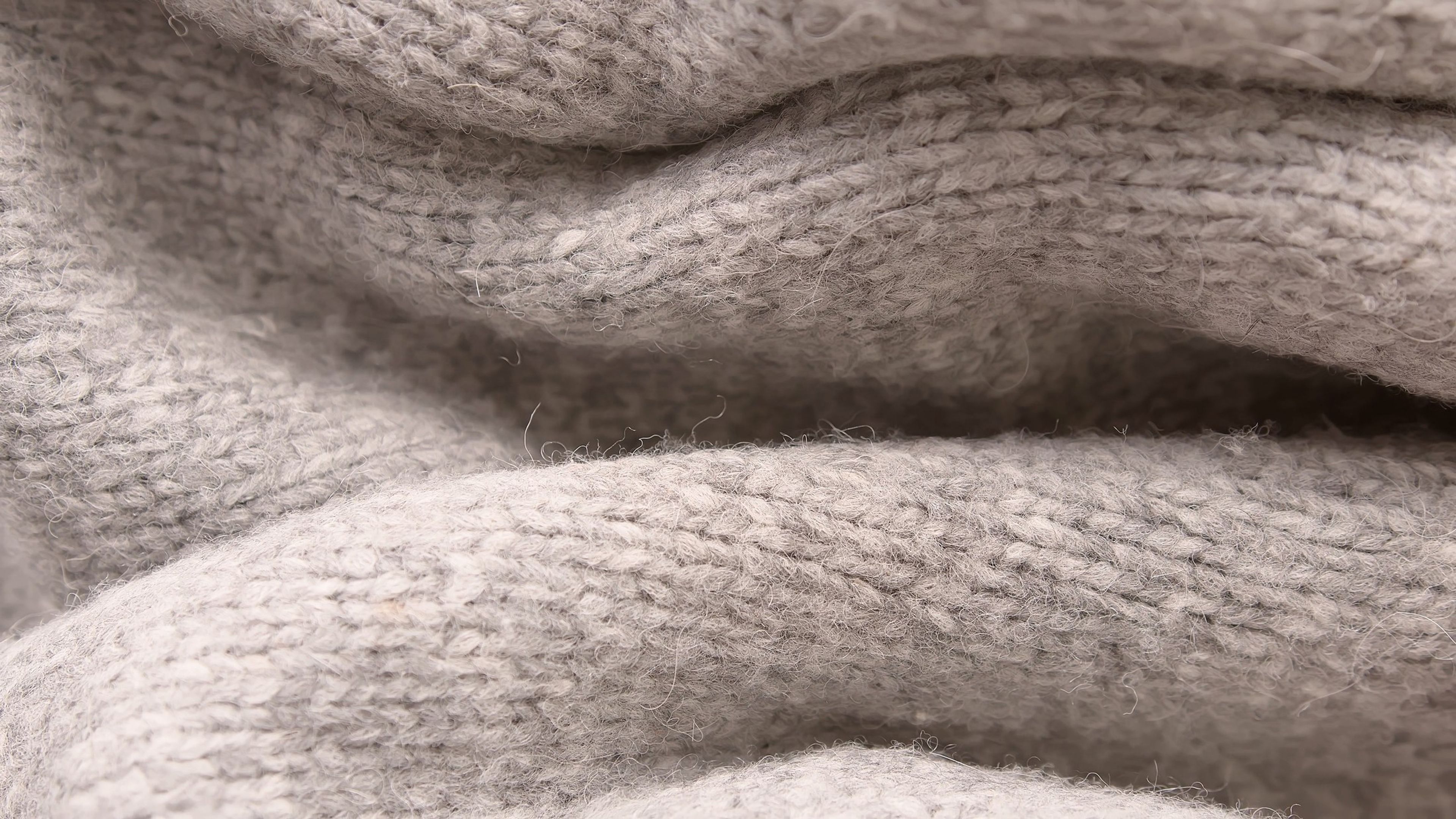 Close-up of soft beige knitted fabric