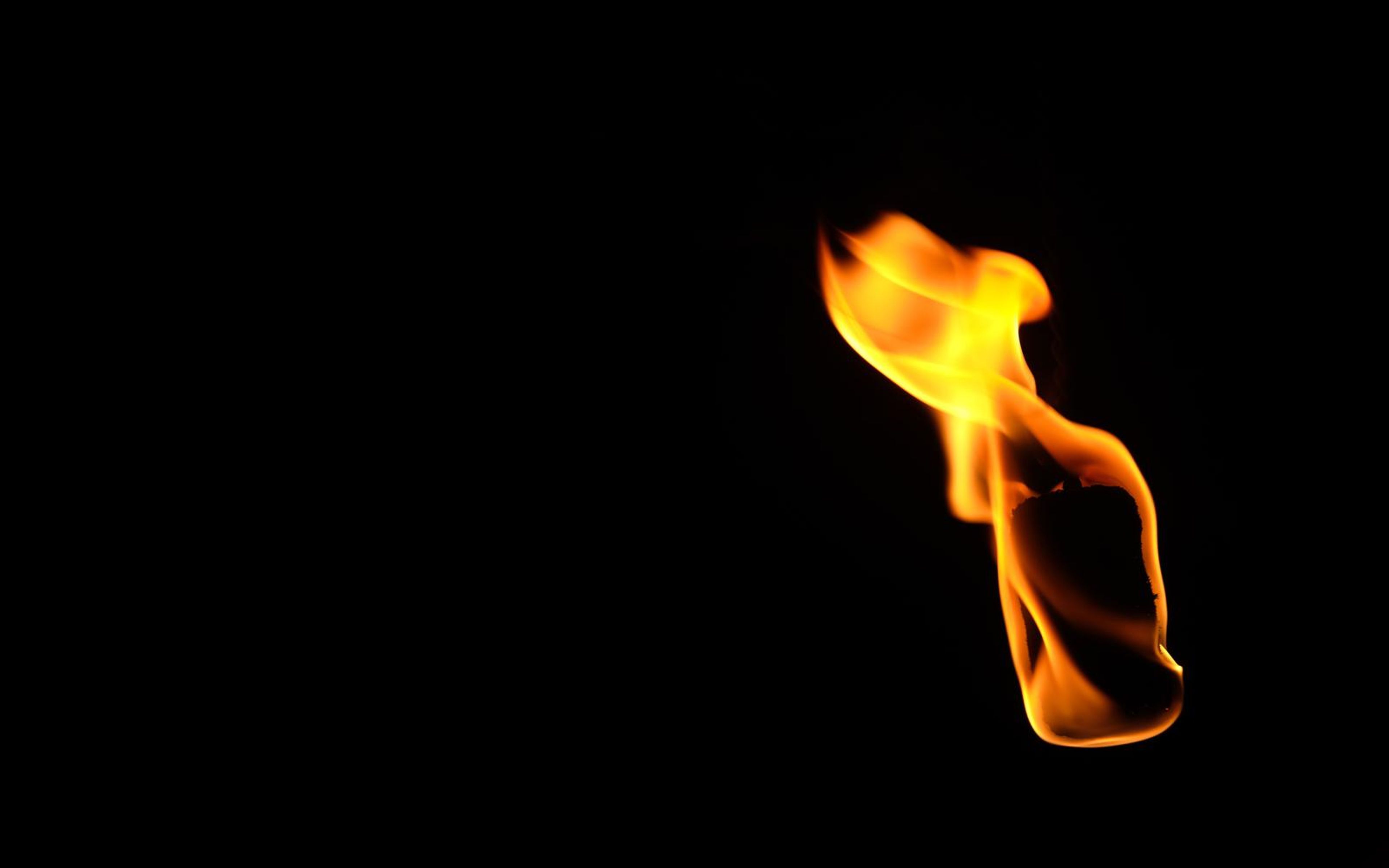Small flame at right with a folded top and a rounded base
