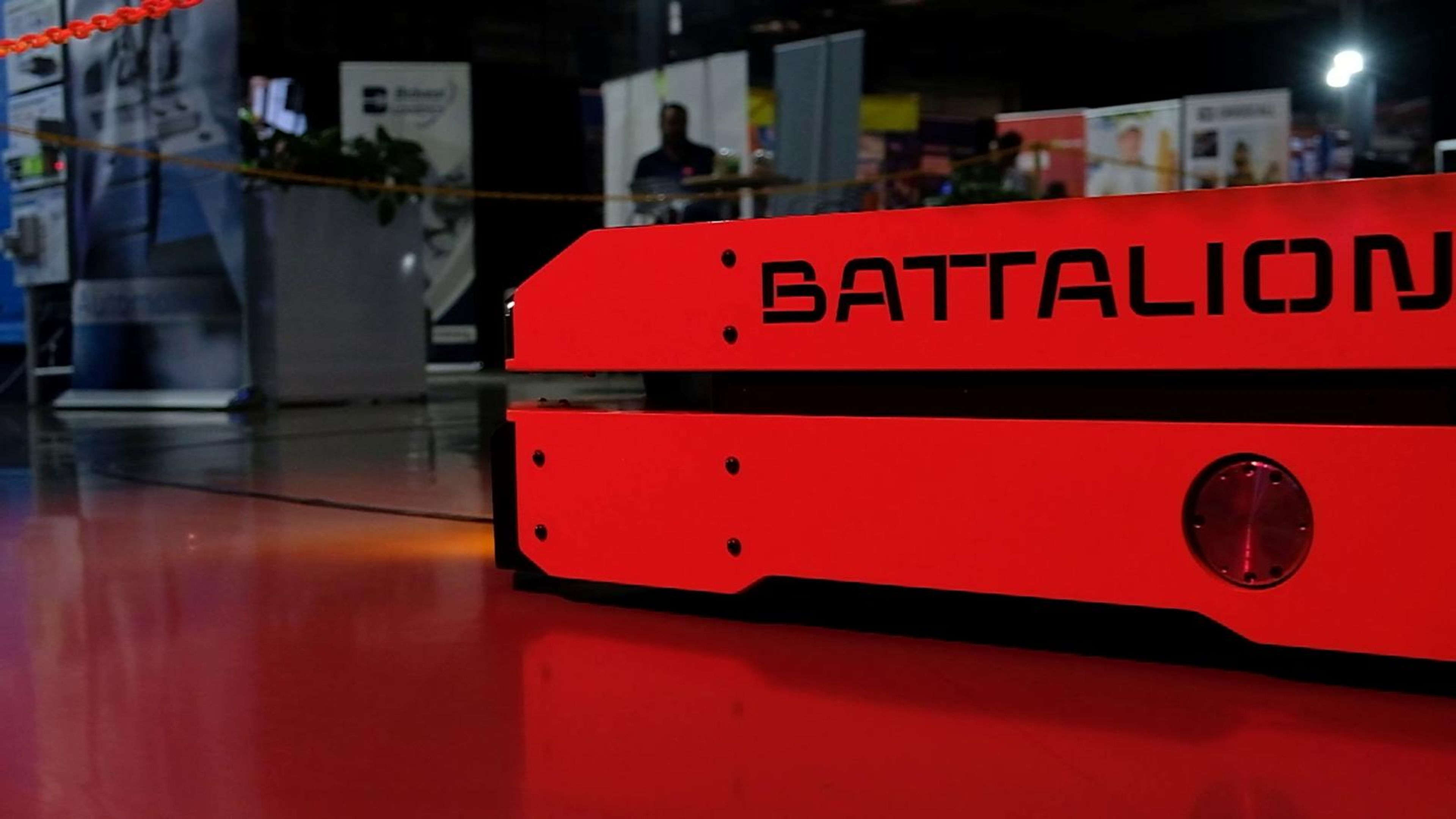 Red Battalion automated vehicle on a red floor