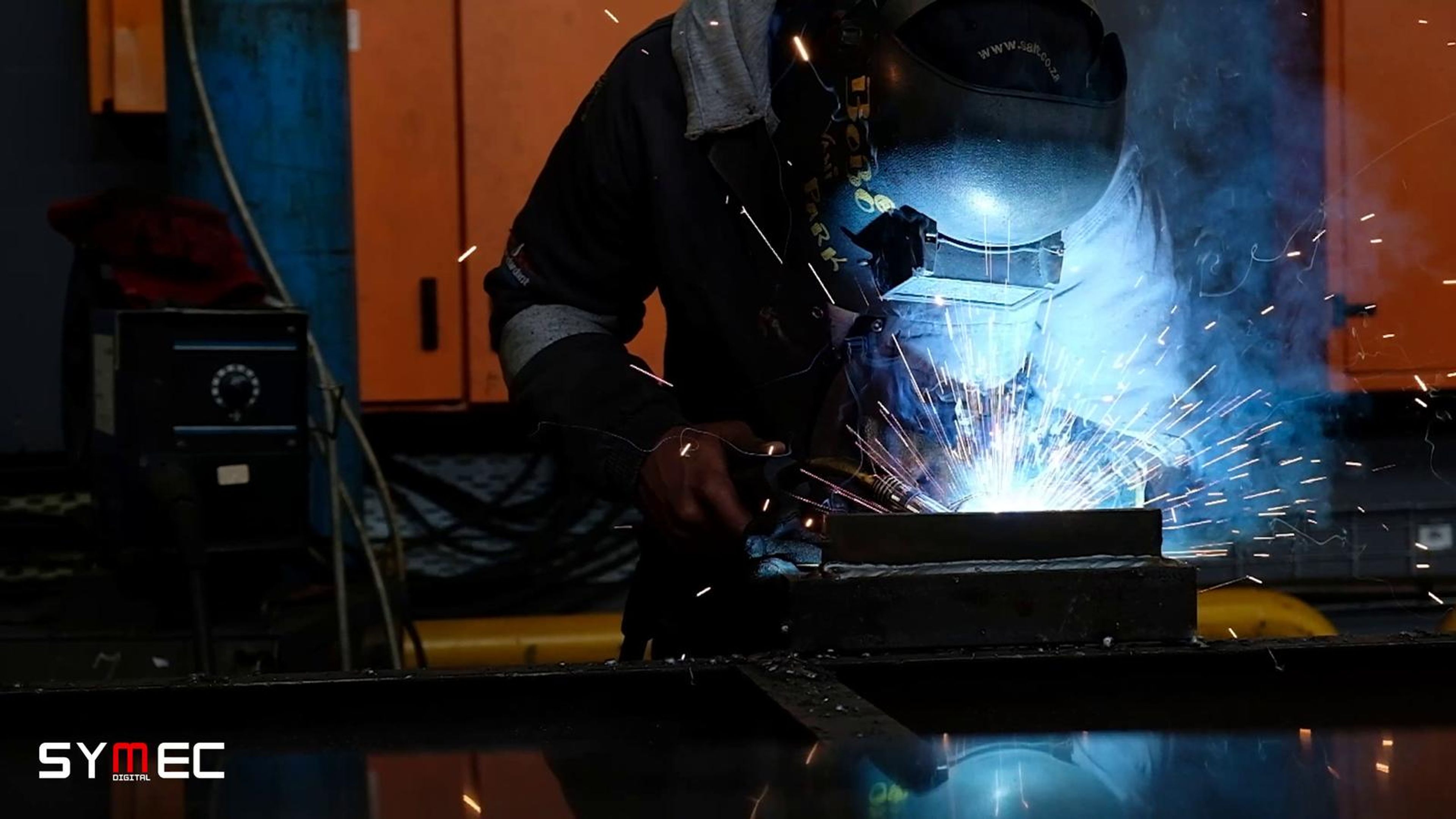 Sparks flying as steel is ground in a workshop
